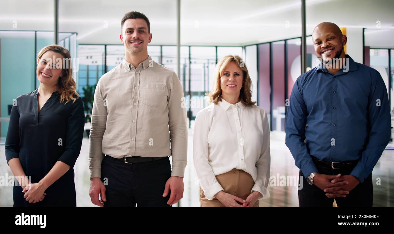 Happy Group Of Business People Standing In Office Stock Photo