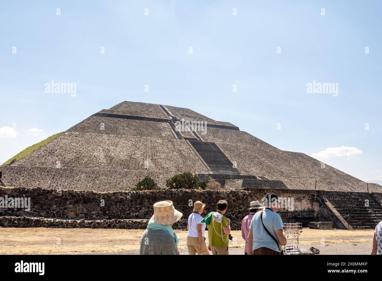 Tourists explore Teotihuacán, ancient Mesoamerican city famous for its impressive pyramids, including the Pyramid of the Sun and the Pyramid of the Moon. Stock Photo