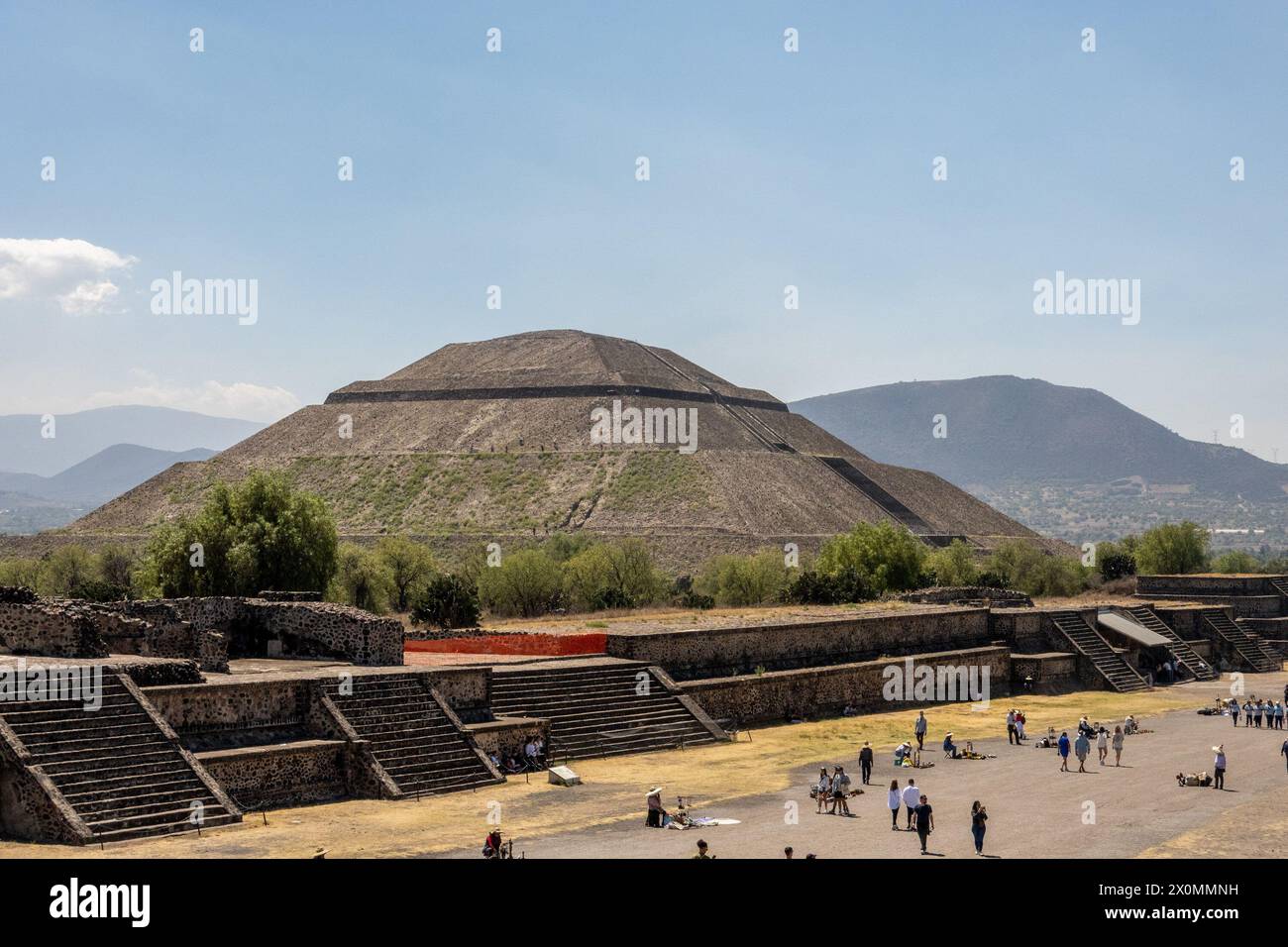 Tourists explore Teotihuacán, ancient Mesoamerican city famous for its impressive pyramids, including the Pyramid of the Sun and the Pyramid of the Moon. Stock Photo