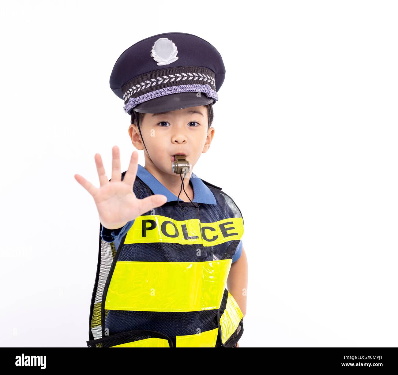 child dressed as a police officer standing and showing stop sign Stock ...