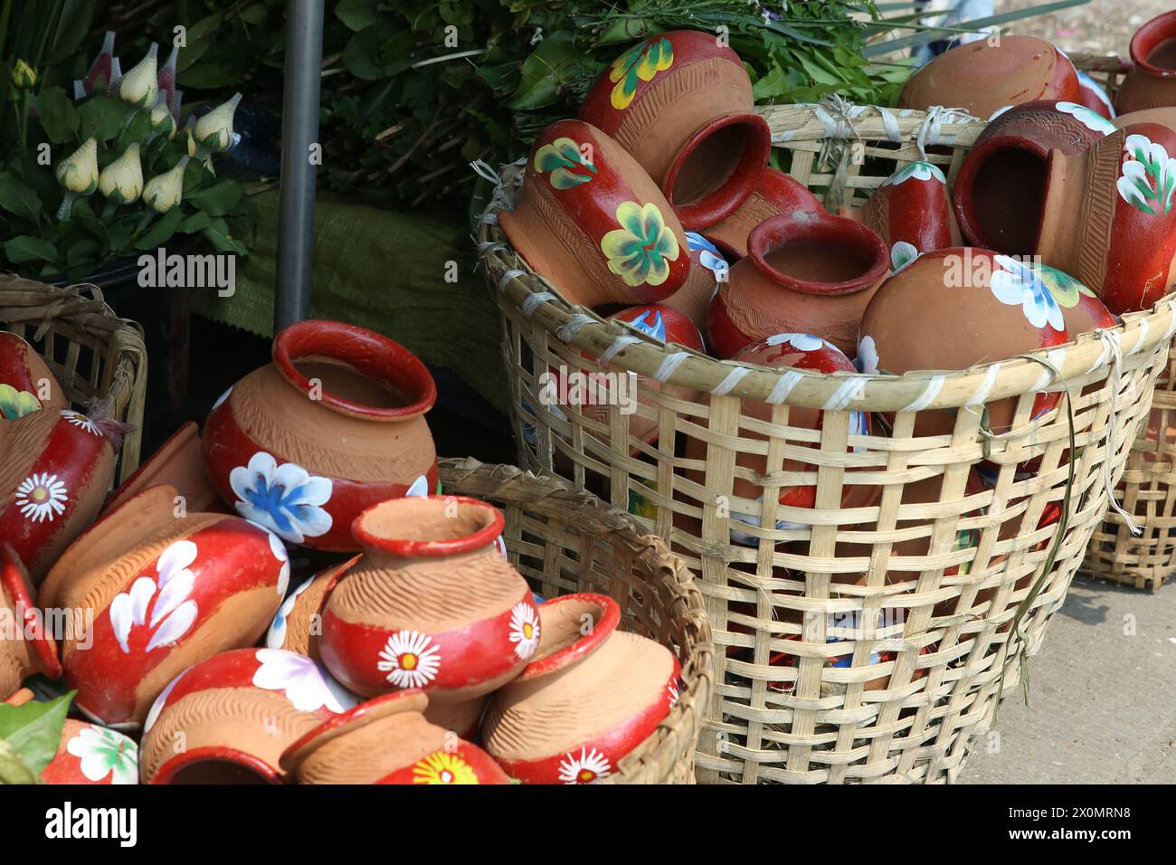 Yangon. 13th Apr, 2024. This photo taken on April 13, 2024 shows Atar pots in Yangon, Myanmar. TO GO WITH 'Feature: Myanmar people prepare Thingyan pot to welcome traditional water festival' Credit: Myo Kyaw Soe/Xinhua/Alamy Live News Stock Photo