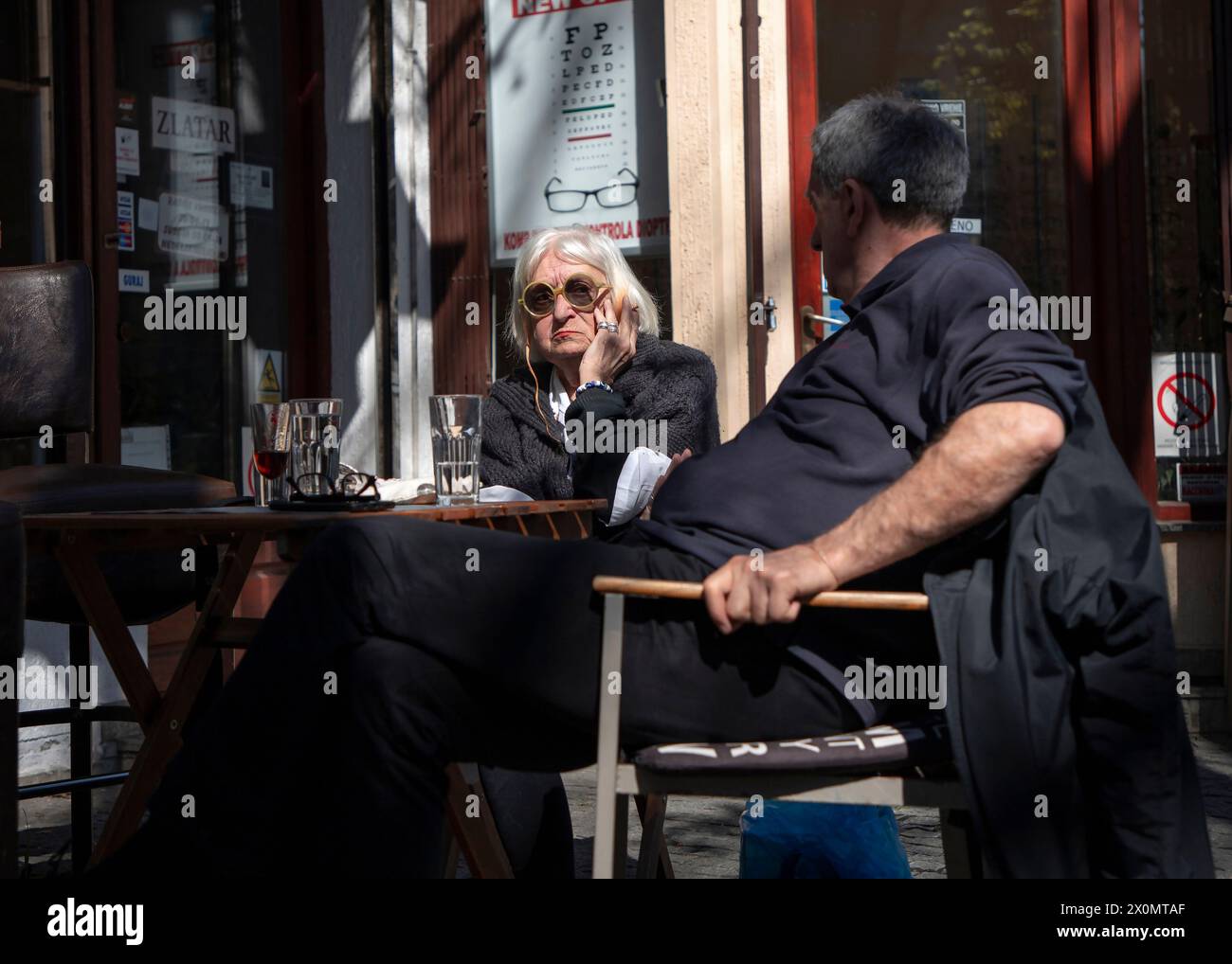Belgrade, Serbia, Mar 23, 2024: An elderly couple taking a break at a café Stock Photo