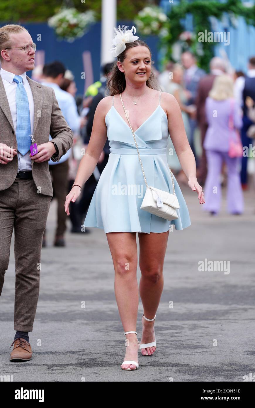 A racegoer on day three of the 2024 Randox Grand National Festival at Aintree Racecourse, Liverpool. Picture date: Saturday April 13, 2024. Stock Photo