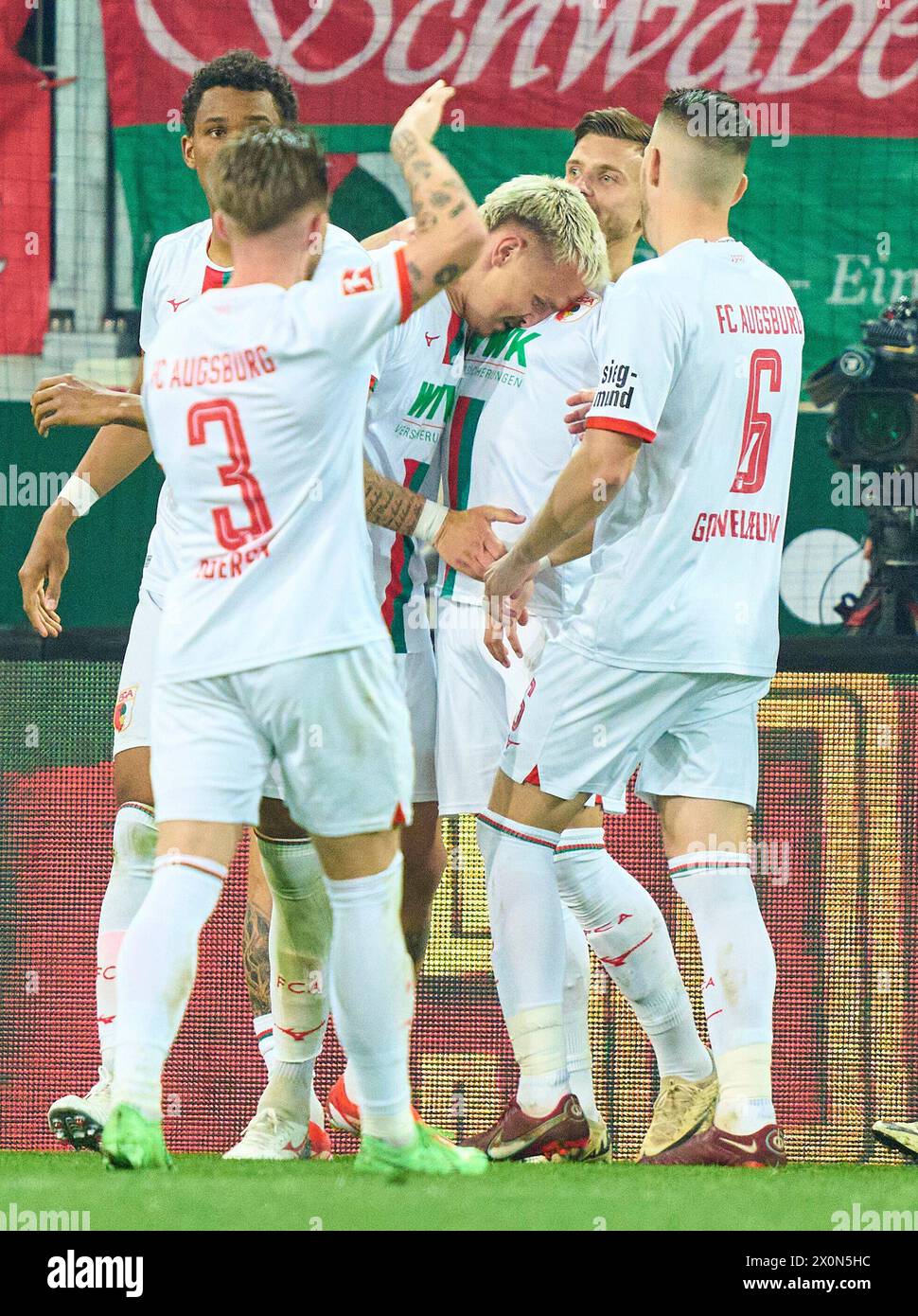 Philip Tietz, FCA 21 celebrates his goal, happy, laugh, celebration, 1-0 in the match FC AUGSBURG - 1. FC Union Berlin 2-0  on Apr 12, 2024 in Augsburg, Germany. Season 2023/2024, 1.Bundesliga, FCA, matchday 29, 29.Spieltag Photographer: ddp images / star-images    - DFL REGULATIONS PROHIBIT ANY USE OF PHOTOGRAPHS as IMAGE SEQUENCES and/or QUASI-VIDEO - Stock Photo