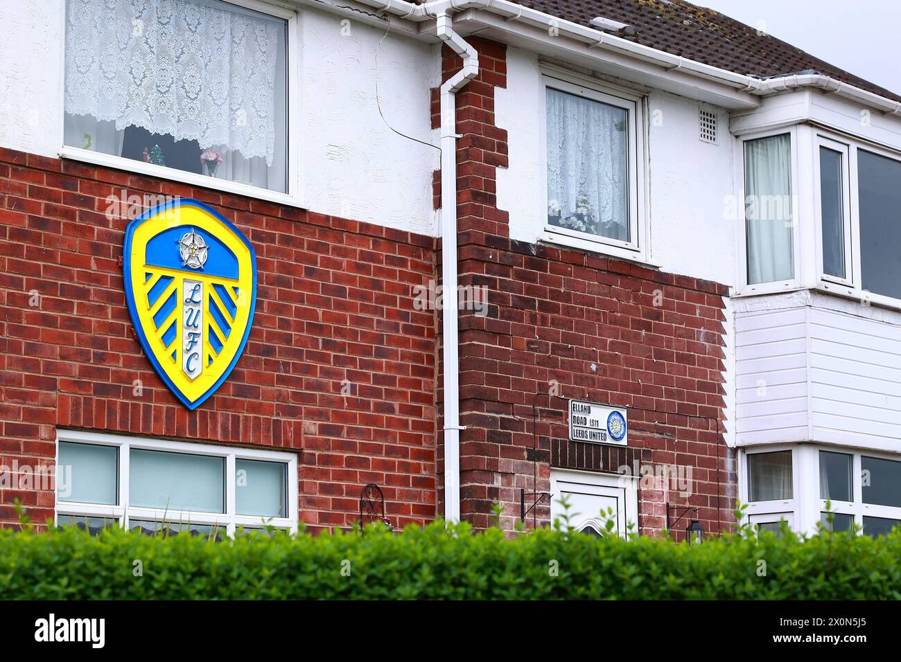 Leeds, UK. 13th Apr, 2024. A house outside of Elland Road, home of Leeds United during adorned with a Leeds United club badge and Elland Road street sign prior to the Leeds United FC v Blackburn Rovers FC sky bet EFL Championship match at Elland Road, Leeds, England, United Kingdom on 13 April 2024 Credit: Every Second Media/Alamy Live News Stock Photo