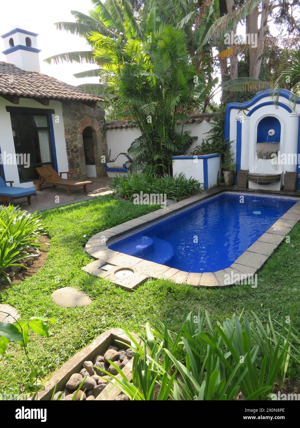 Casa Encantada .Plunge pool and peaceful garden of a  boutique small, intimate hotel in Antigua, once the capital of Guatemala, Central America. Stock Photo