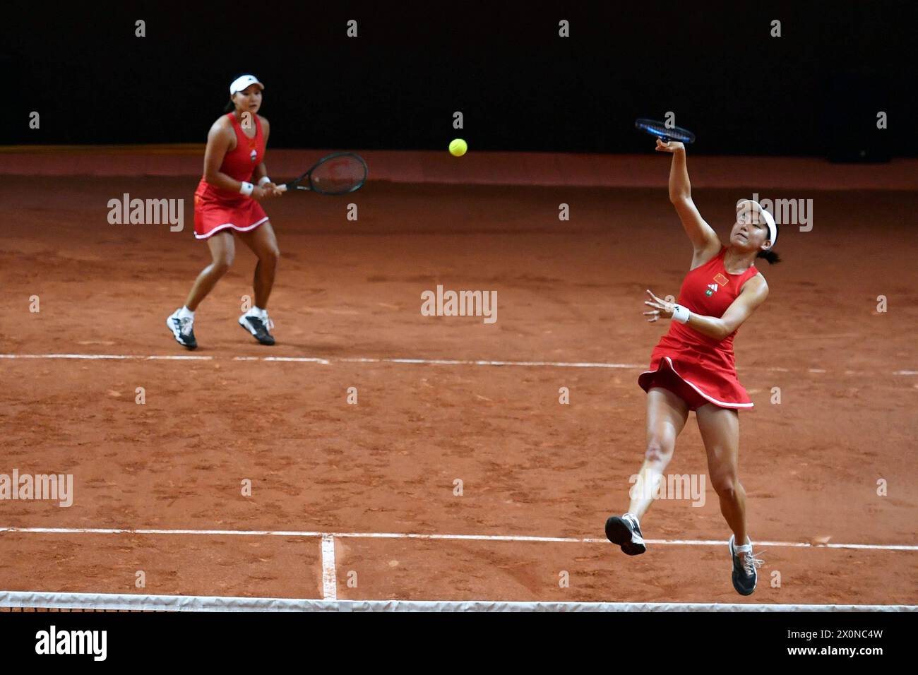 Changsha, China's Hunan Province. 13th Apr, 2024. Wang Xinyu (R)/Guo Hanyu of China compete during the women's doubles match against Kim Dabin/Park Sohyun of South Korea at the Billie Jean King Cup 2024 tennis tournament Asia-Oceania Group I match in Changsha, central China's Hunan Province, April 13, 2024. Credit: Chen Zhenhai/Xinhua/Alamy Live News Stock Photo