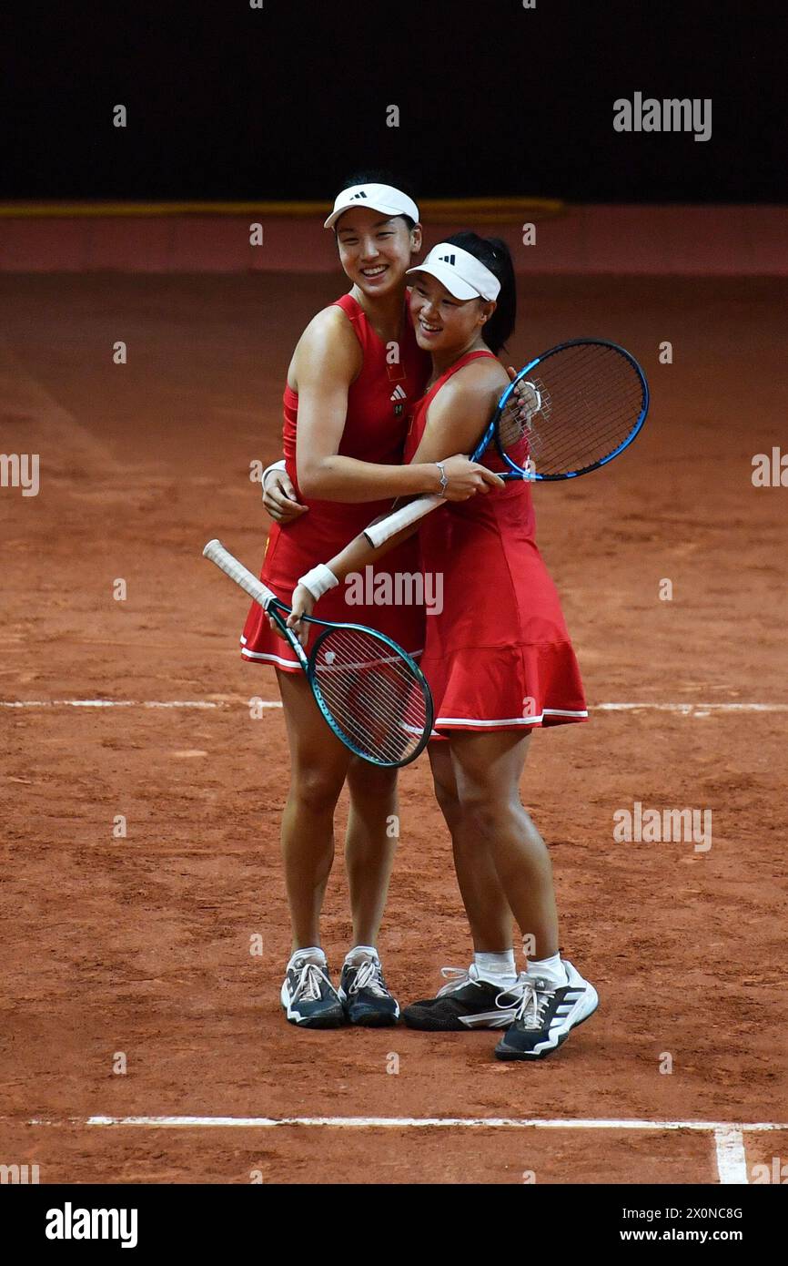 Changsha, China's Hunan Province. 13th Apr, 2024. Wang Xinyu (L)/Guo Hanyu of China celebrate after the women's doubles match against Kim Dabin/Park Sohyun of South Korea at the Billie Jean King Cup 2024 tennis tournament Asia-Oceania Group I match in Changsha, central China's Hunan Province, April 13, 2024. Credit: Chen Zhenhai/Xinhua/Alamy Live News Stock Photo