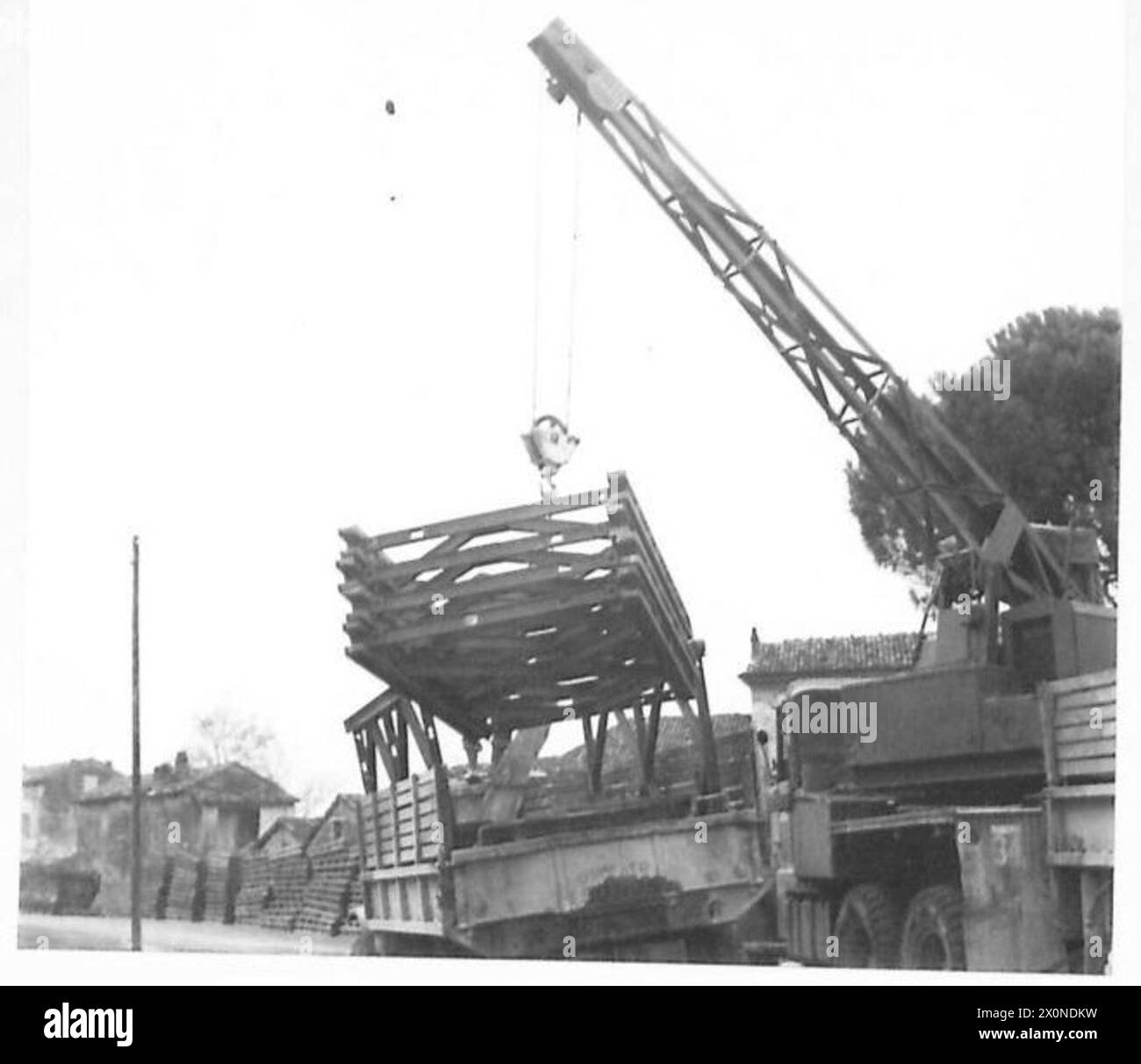 EIGHTH ARMY : PORTER FORCE - In the Porter Force area there are numerous canals and small roads, and the Germans have systematically blown bridges. Engineers call on this dump for small Bailey bridges to bridge the gaps left by these demolitions. Photographic negative , British Army Stock Photo