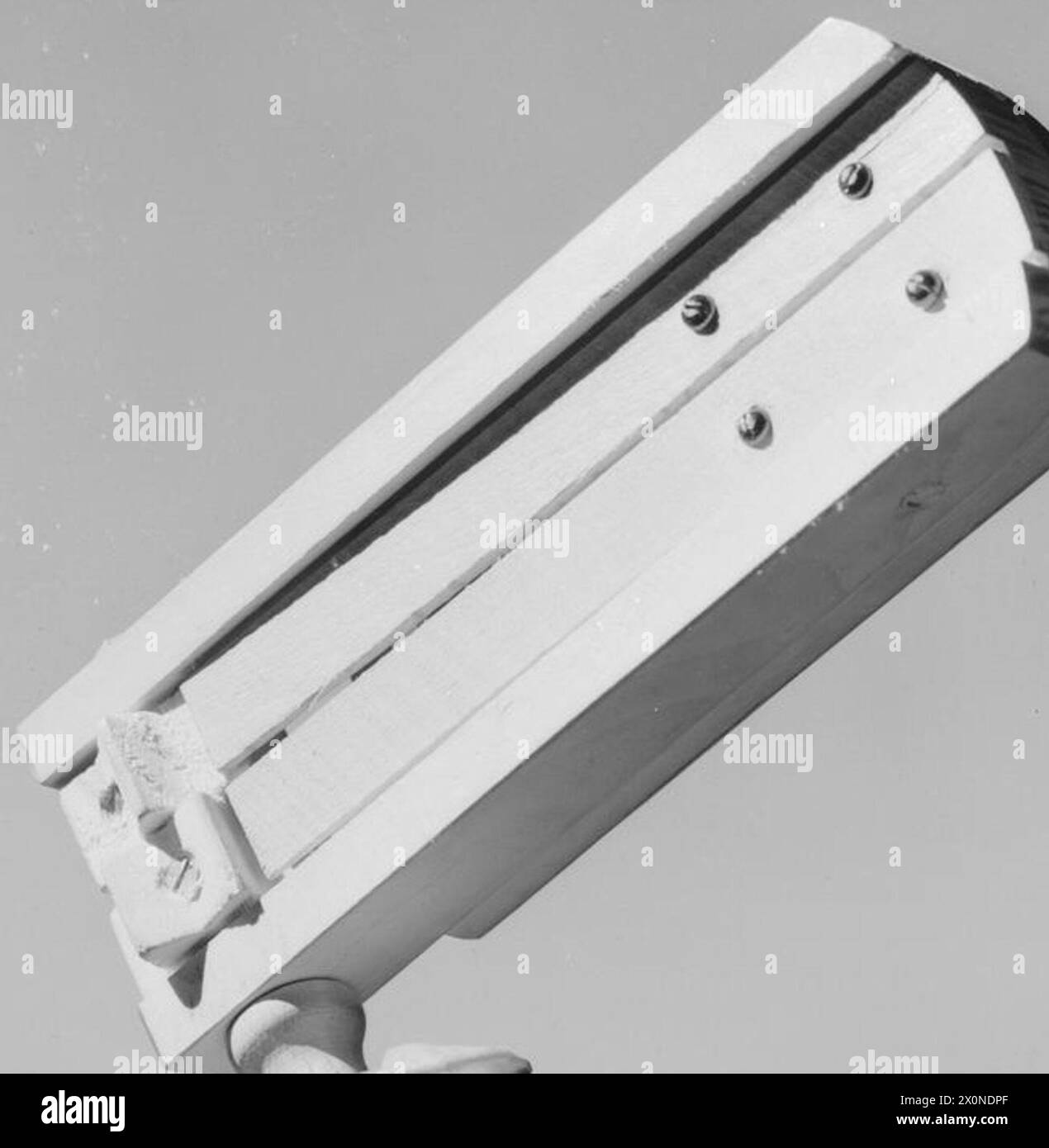 A gas rattle device is shown, used during World War II to signal the ...
