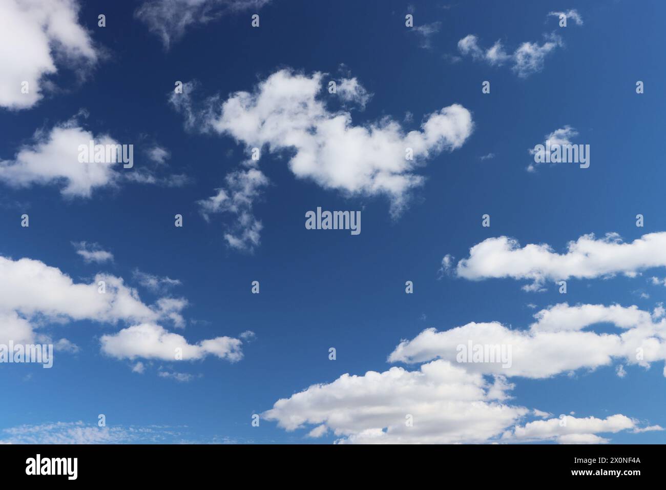 Cloud clusters scattered in blue sky With copyspace for text. Stock Photo
