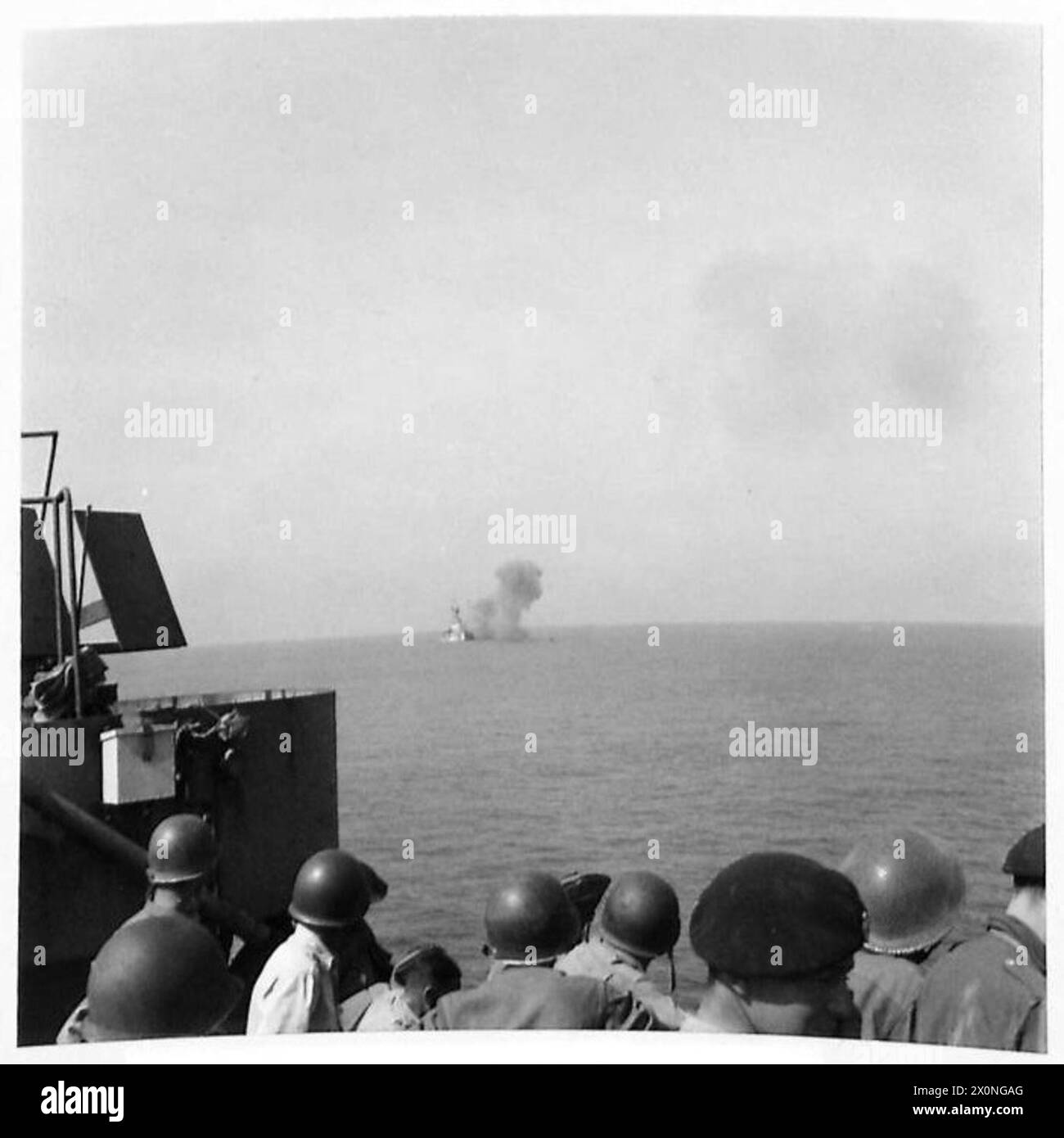 INVASION OF ITALY : NAPLES AREA FIFTH ARMY LANDS IN SALERNO BAY - Allied troops aboard one of the landing craft watch(the cruiser) a Monitor shelling enemy positions on the outskirts of Salerno. Photographic negative , British Army Stock Photo