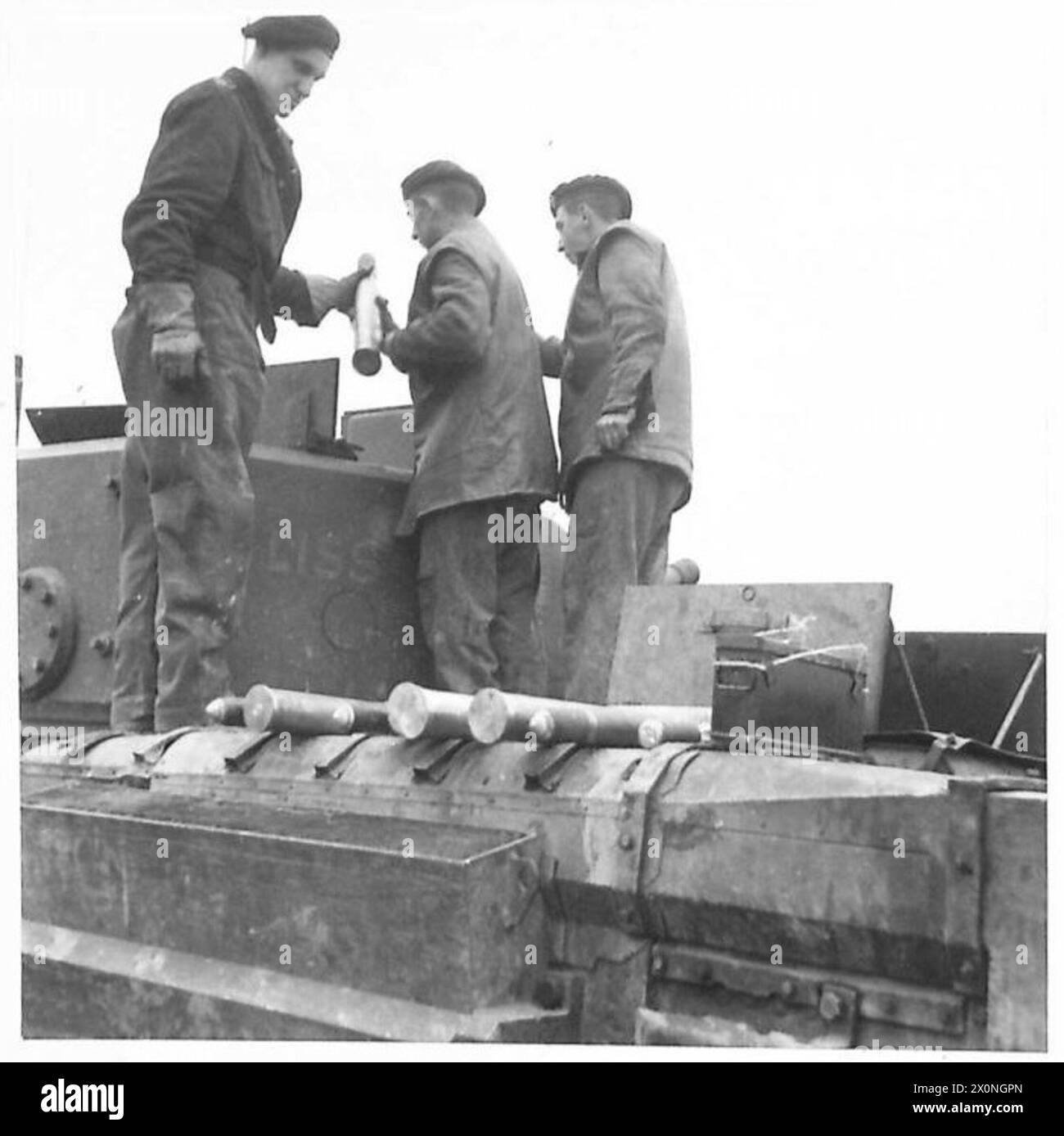 TANK CREWS IN TRAINING - Personnel loading shells into Churchill tanks. Photographic negative , British Army Stock Photo