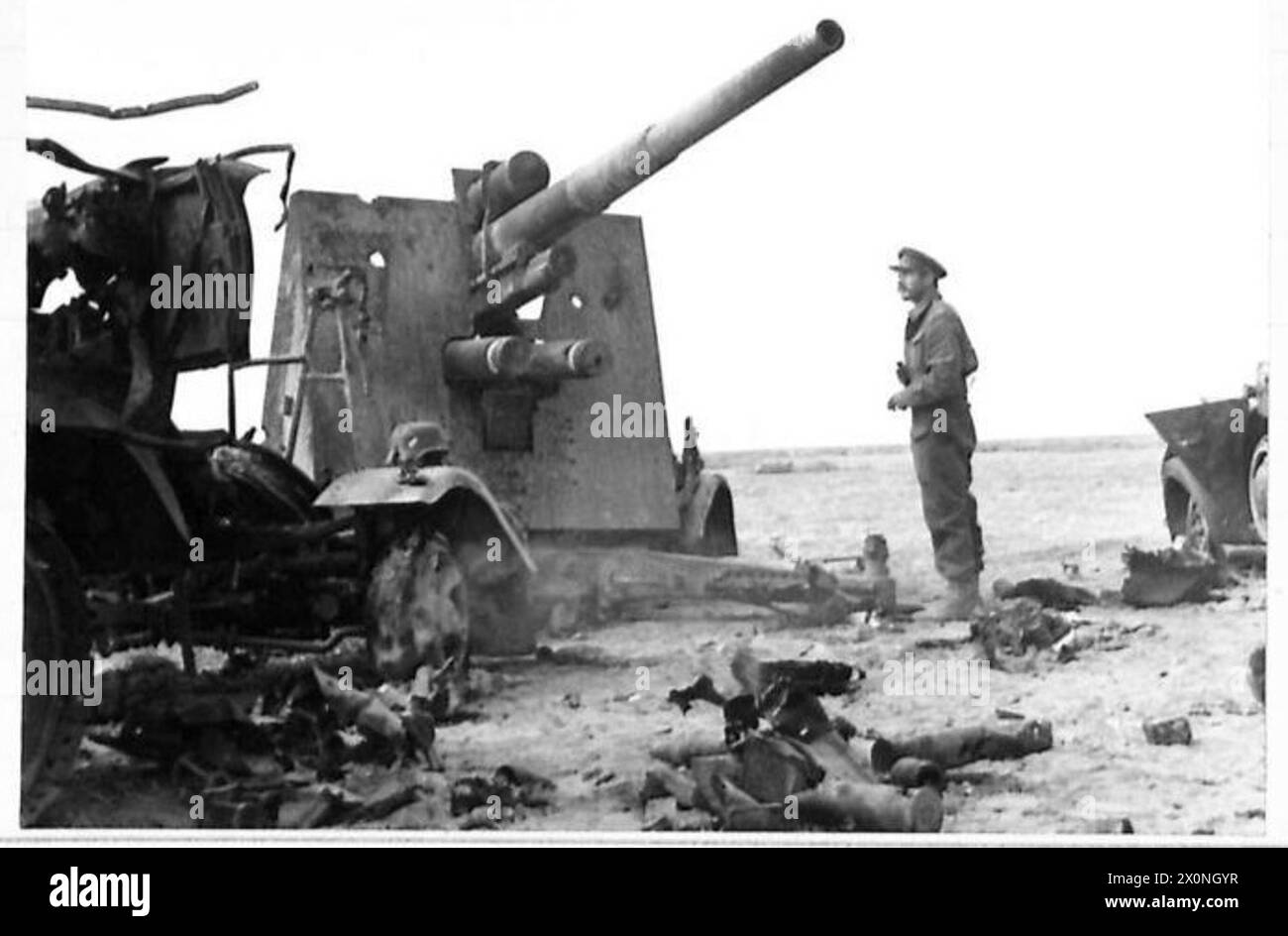 THE BATTLE IN THE WESTERN DESERT - A German dual-purpose 66 Mill Gun which was putout of action by our artillery near El Gubbi. The gun is used both for A.A. and long range shelling. Photographic negative , British Army Stock Photo
