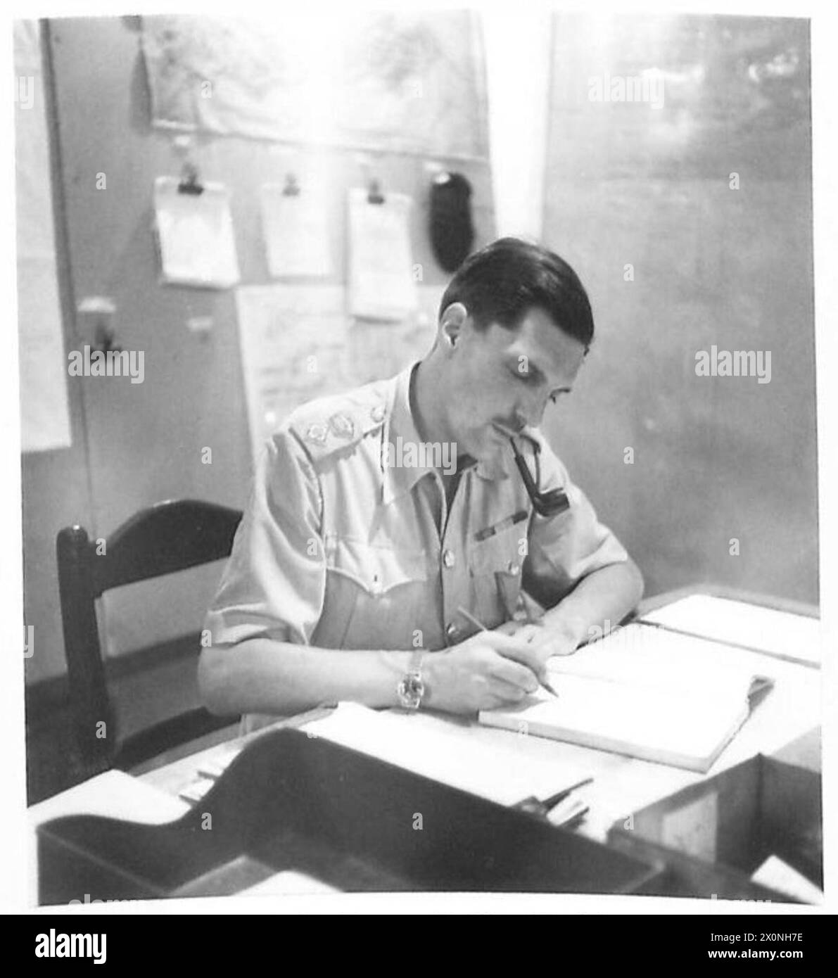 OPERATIONS ROOM MALTA - Boss of the Ops room is the G.S.O.1 (OPS) - Lieut. Col. Belcham, DSO, Royal Tank Regiment of Kensington. Photographic negative , British Army Stock Photo