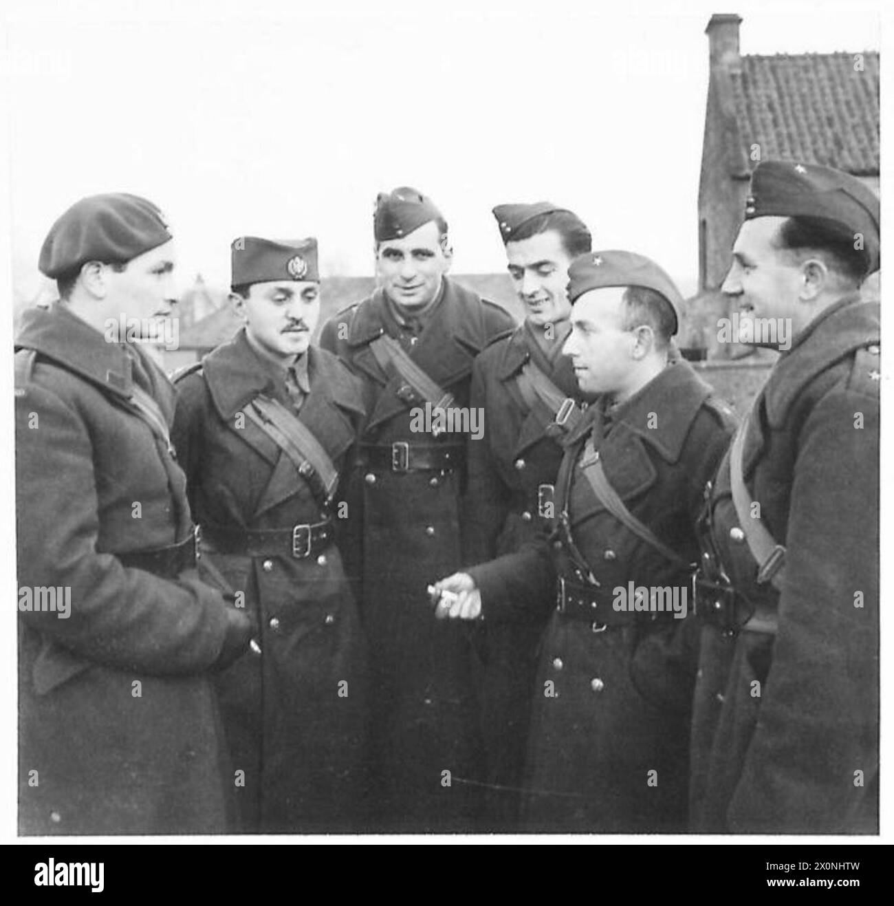 YUGOSLAV ARMY UNIT IN TRAINING - A group of Jugoslav officers chatting