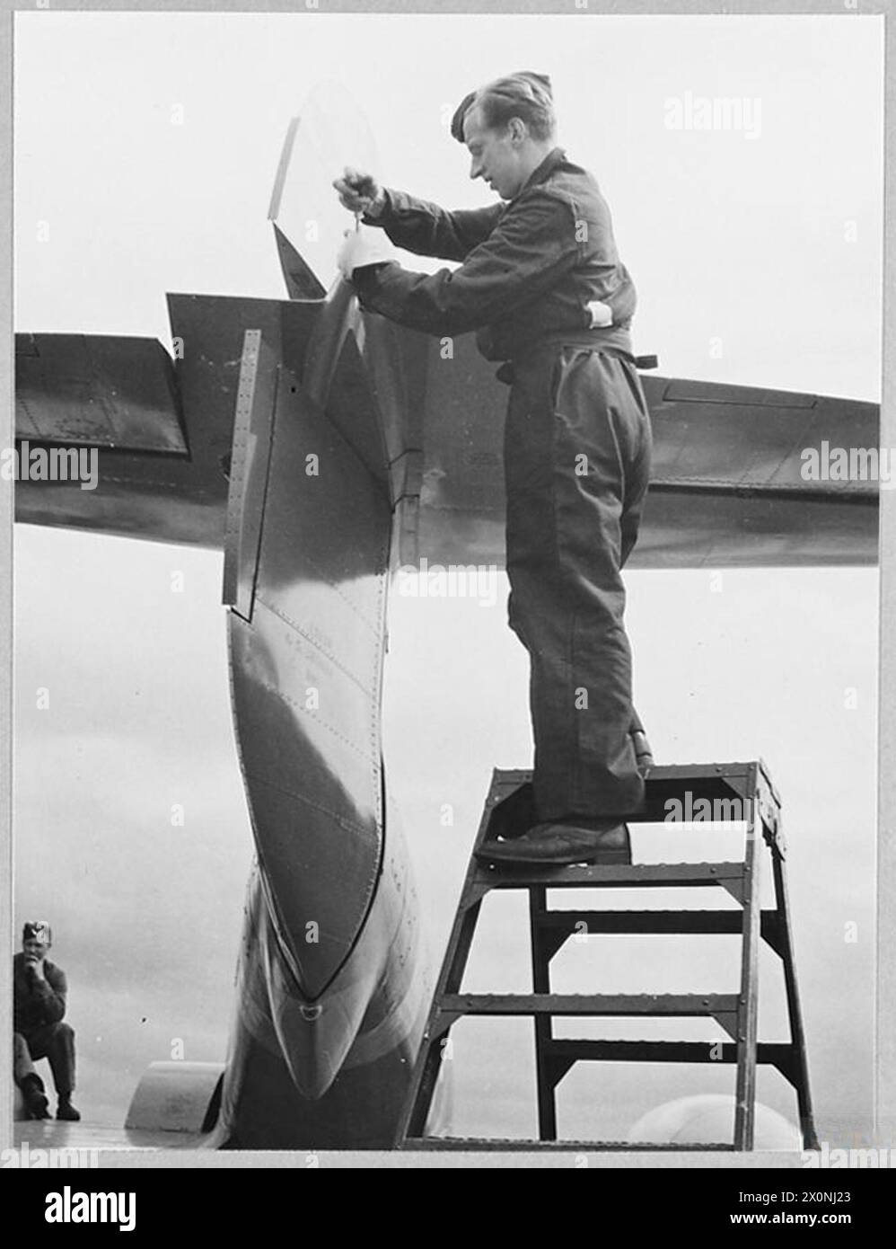 WORK AT AN R.A.F. STATION Picture issued 1945 shows An R.A.F.fitter