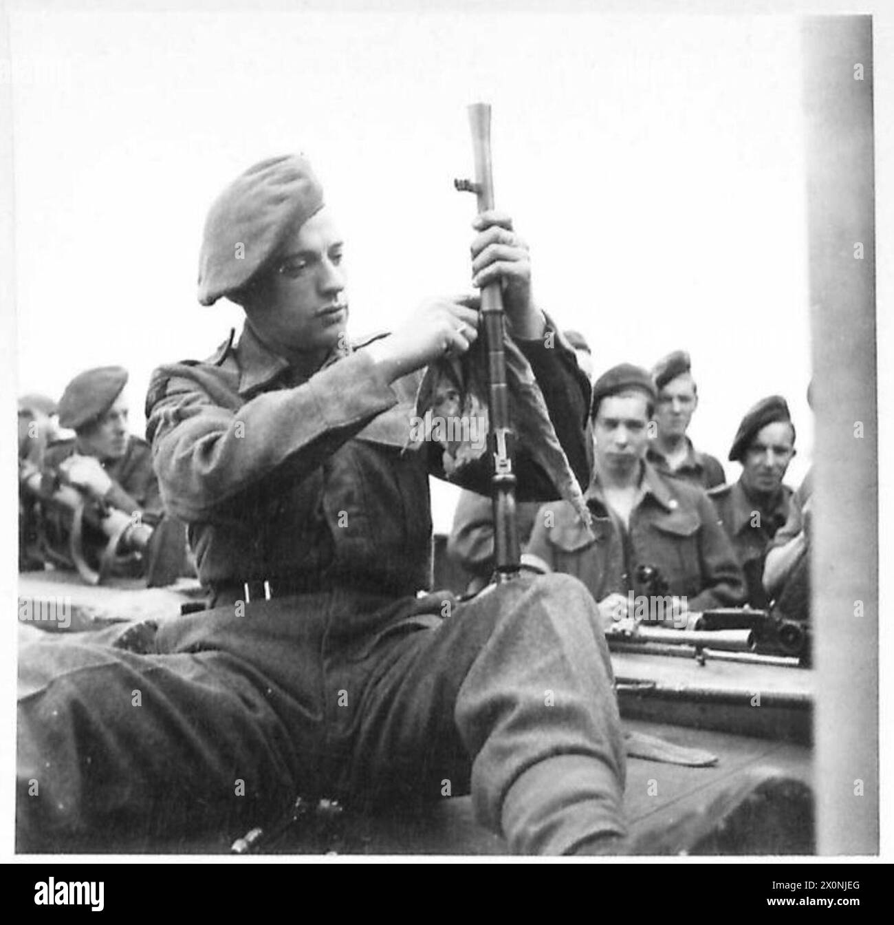 Corporal Alan Winterbottom of the Green Howards cleans his Bren gun ...