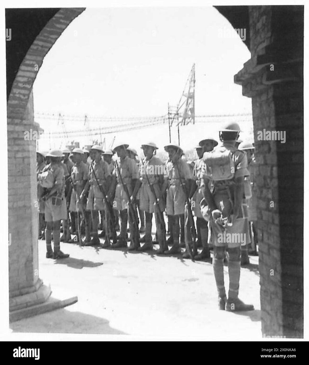 PICTURES FROM IRAN (PERSIA) - Indian troops lined up outside the H.Q. of the Anglo-Iranian Oil Co. on Aradian Island. Photographic negative , British Army Stock Photo