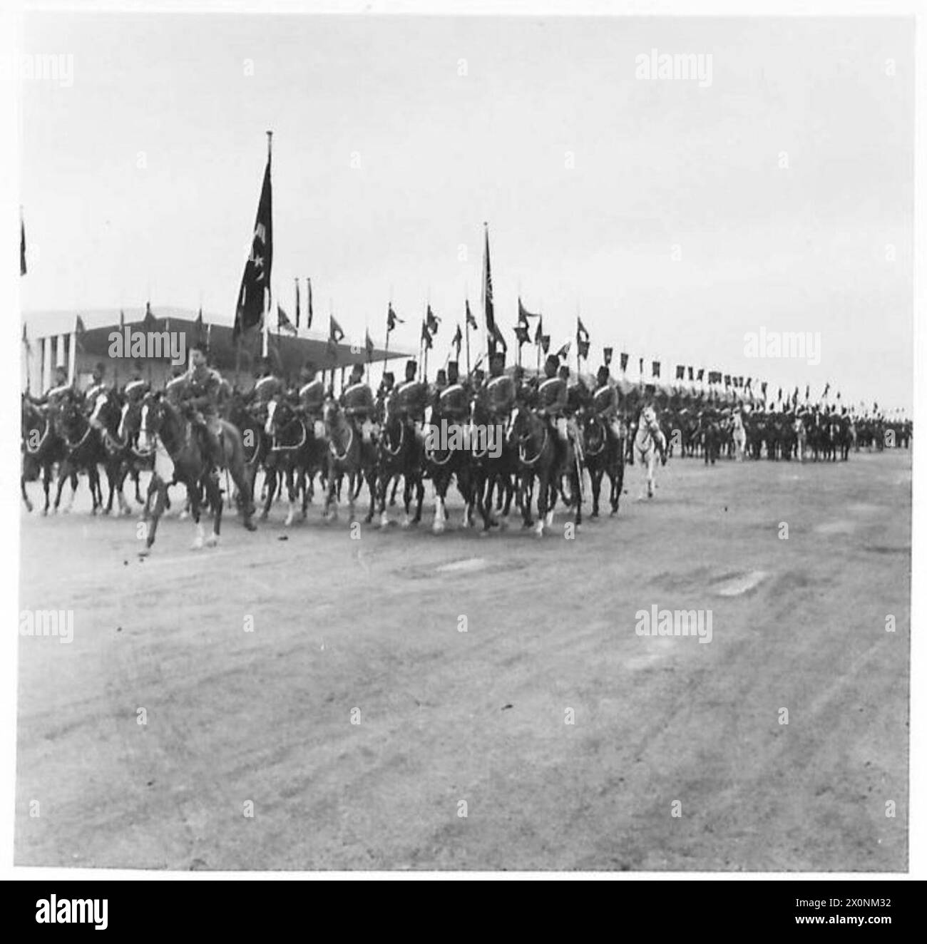 KING IBN SAUD SEES EGYPT'S MILITARY MIGHT - With pennants flying 