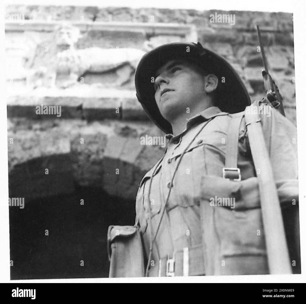 PHOTOGRAPHS TAKEN IN CYPRUS - A sentry on duty beside one of the ancient walls of a town in Cyprus Photographic negative , British Army Stock Photo