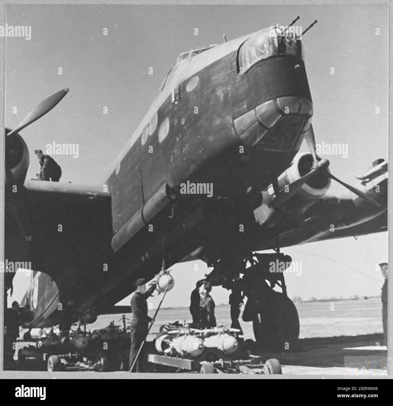R.A.F. STIRLING AIRCRAFT BEING BOMBED-UP FOR A RAID [Picture issued ...