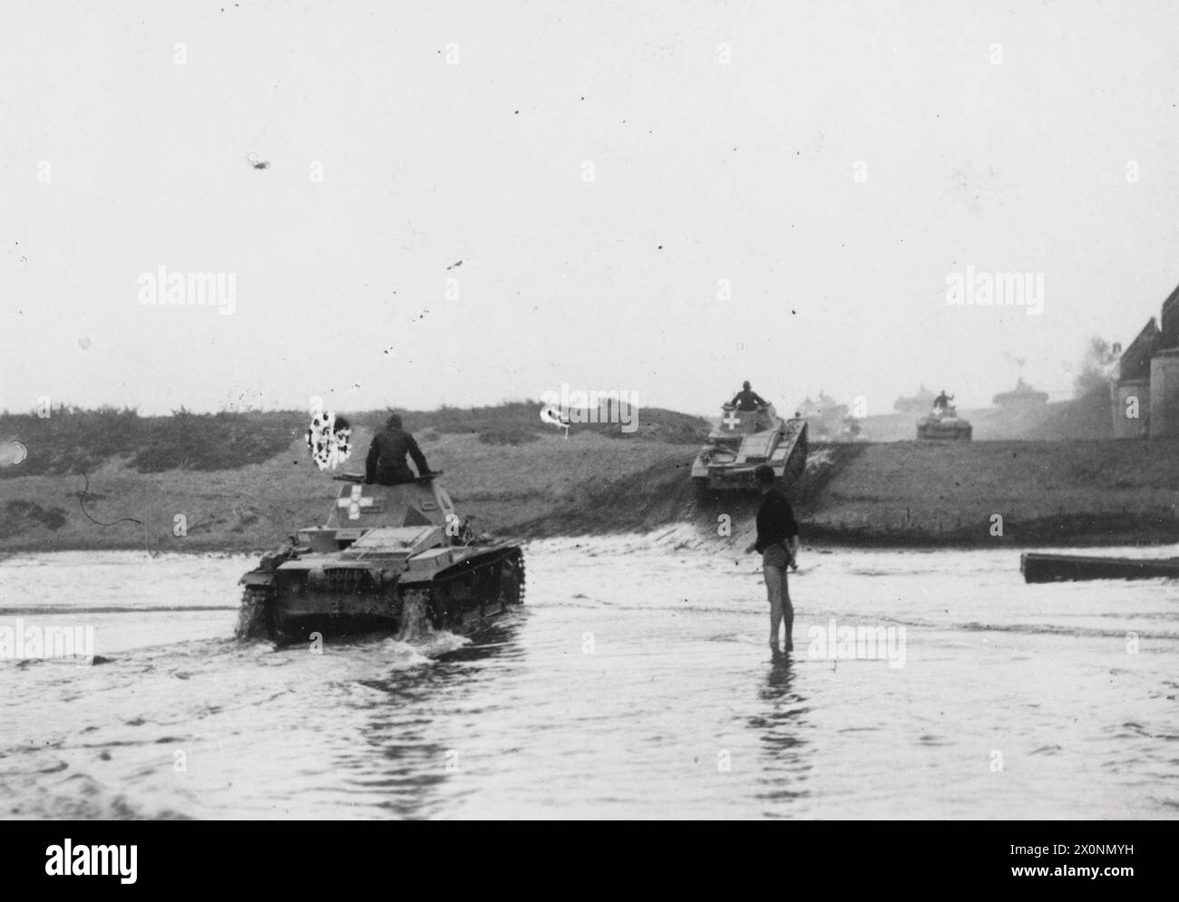 THE GERMAN-SOVIET INVASION OF POLAND, 1939 - German Panzer II tanks crossing a river in Poland. Note clear 'Balkenkreuz' emblems on the back of their turrets German Army Stock Photo