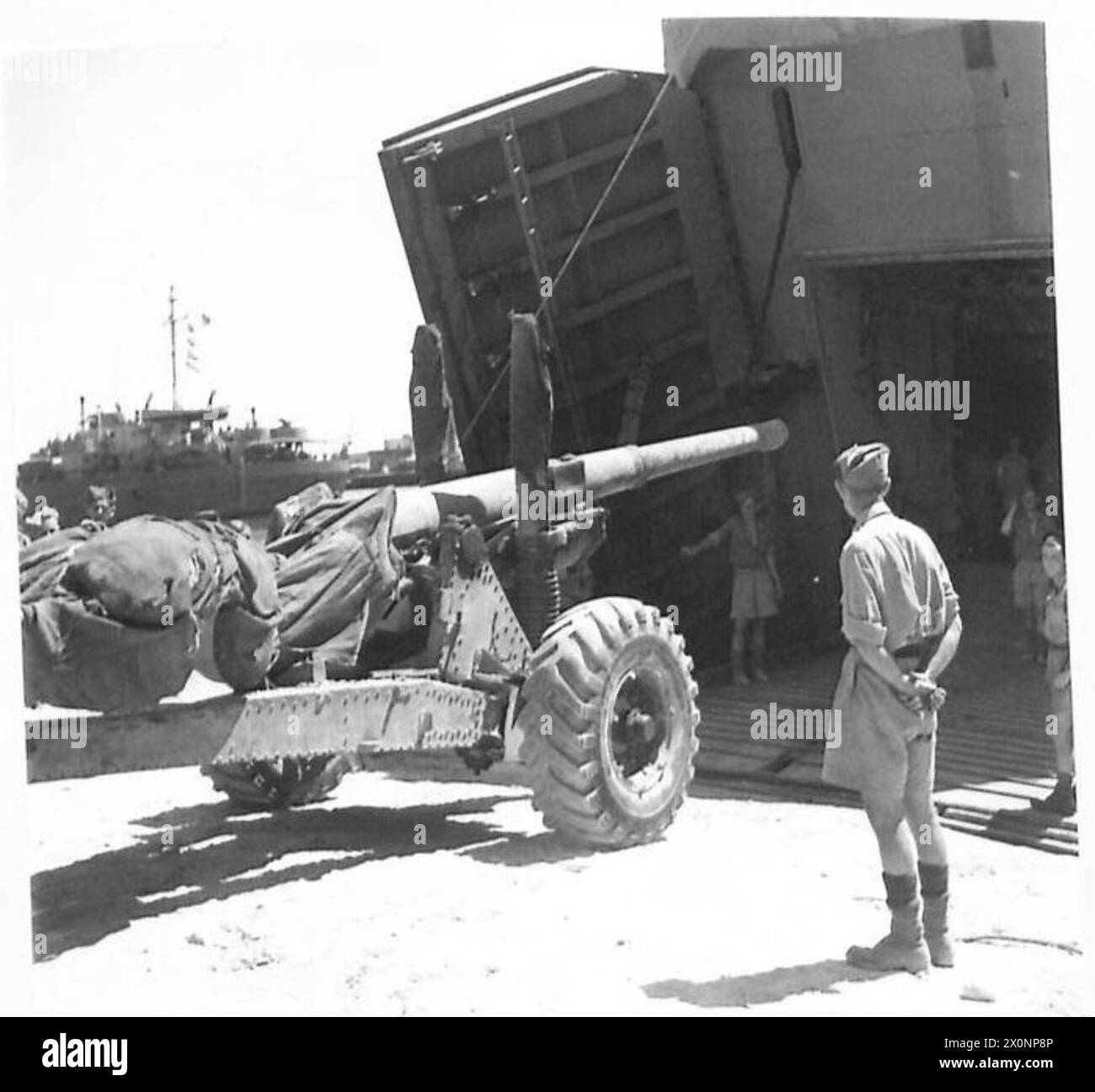 INVASION OF ITALY - Artillery going aboard Landing Craft Photographic negative , British Army Stock Photo