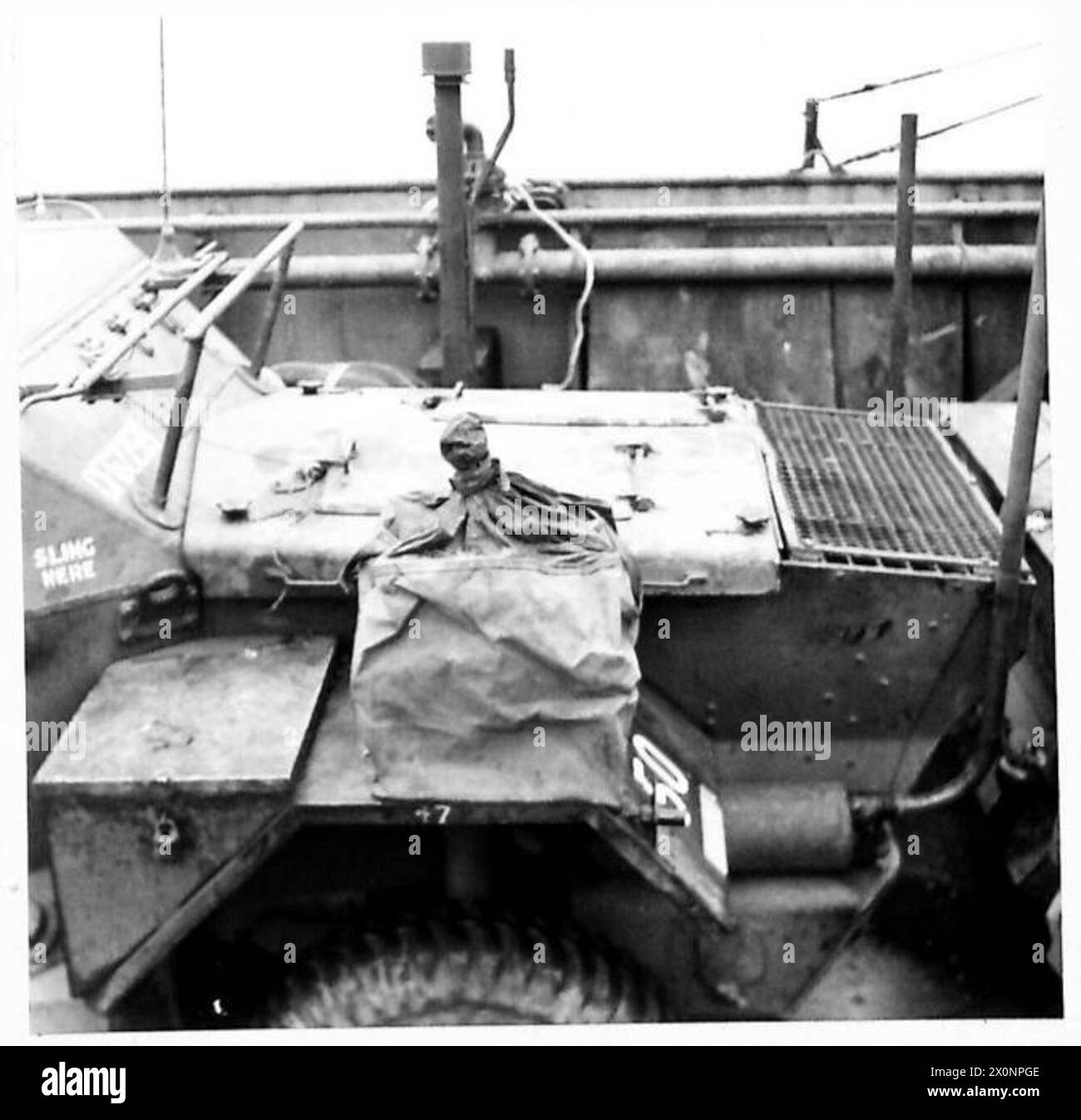 WADING TRIALS OF DAIMLER SCOUT CARS AND FORD LYNX SCOUT CARS AT NO.1 WADING TRIALS CENTRE, WEYMOUTH, DORSET - The Chore Horse, W/T generating unit on Lynx scout car enclosed in waterproof bag. Photographic negative , British Army Stock Photo