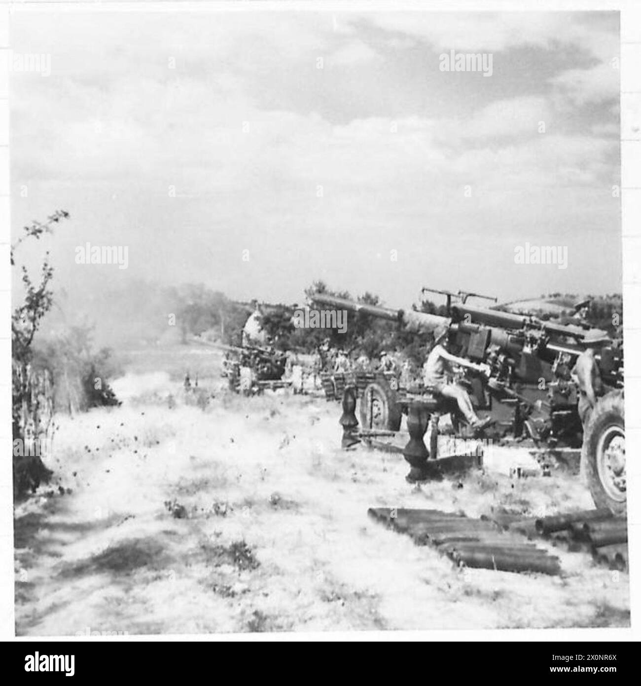 3.7-inch anti-aircraft guns of the 97 Heavy A.A. Regiment, Royal Artillery, fire as ground artillery against Gothic Line positions during Eighth Army operations in Italy, World War II. Stock Photo