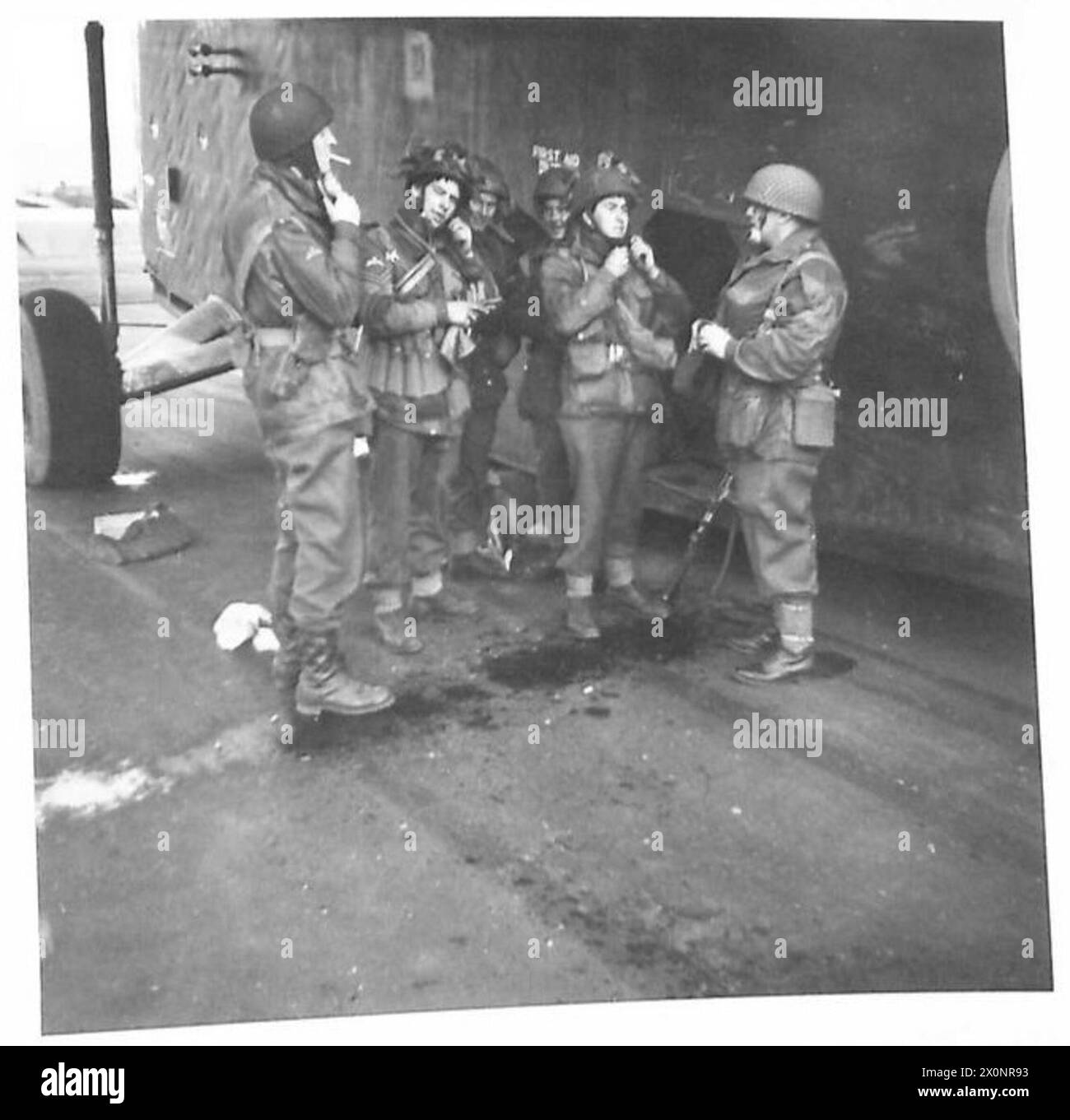 THE AIRBORNE OPERATION - Glider troops adjusting their helmet straps ...