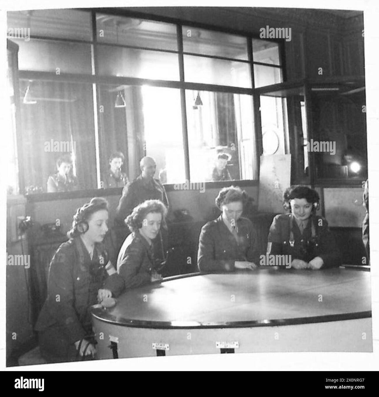 GUN OPERATIONS ROOMS A.T.S. plotters and switchboard personnel