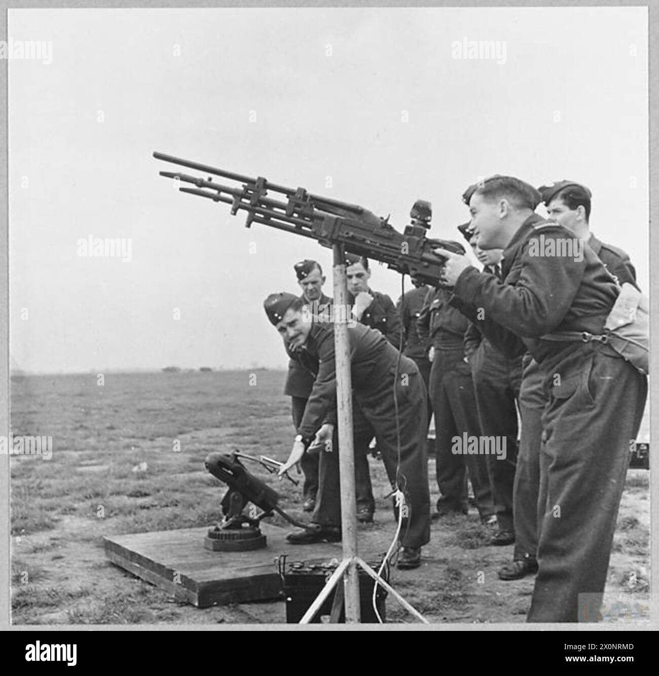 RHODESIANS IN THE R.A.F. - Ground machine gun training for the squadron in progress. Clay pigeons are catapulted into the air, and the twin-machineguns are trained on the rocketing target, but it is the shot gun in the centre which fires. Photographic negative , Royal Air Force Stock Photo