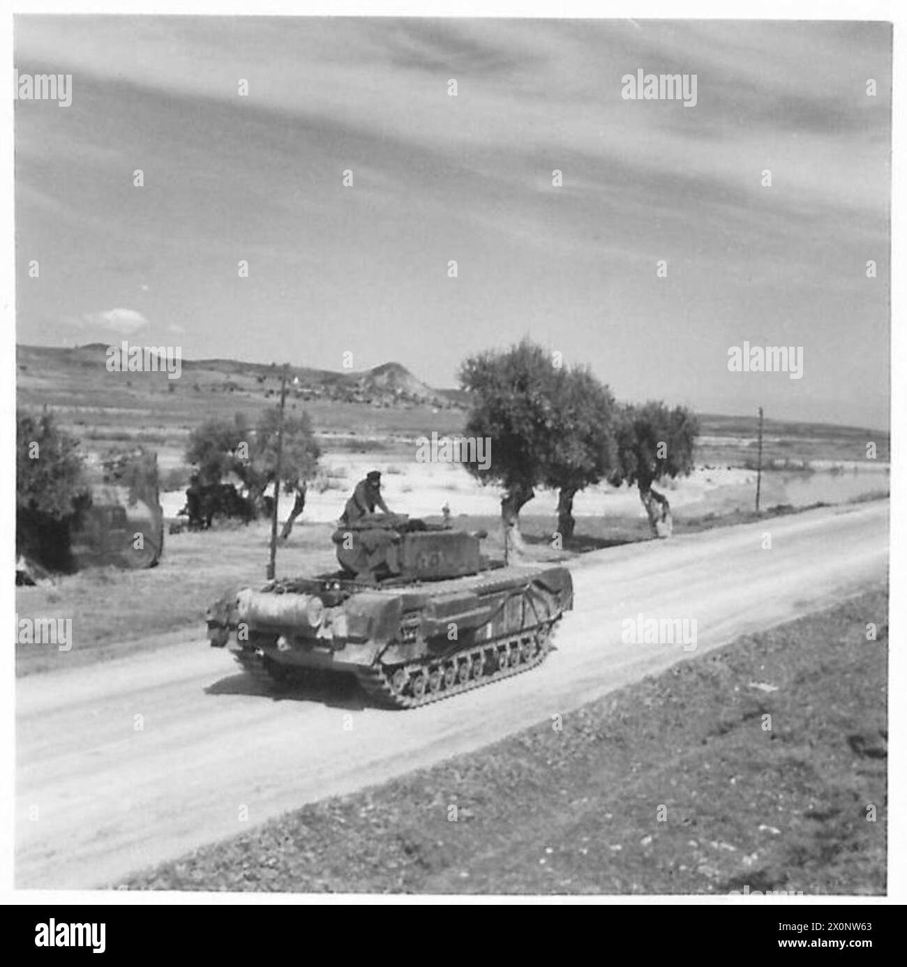 WITH THE CHURCHILLS IN TUNISIA - A Churchill tank crossing a bridge ...