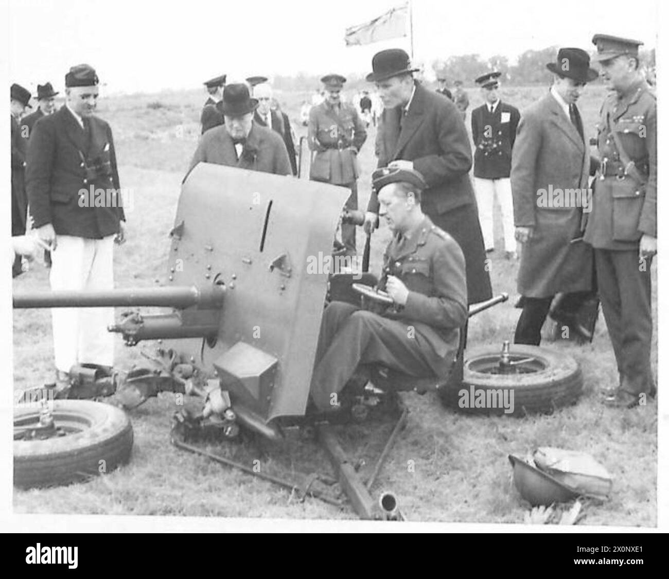 David Margesson Prime Minister Churchill observes a two-pounder anti-tank gun with ...