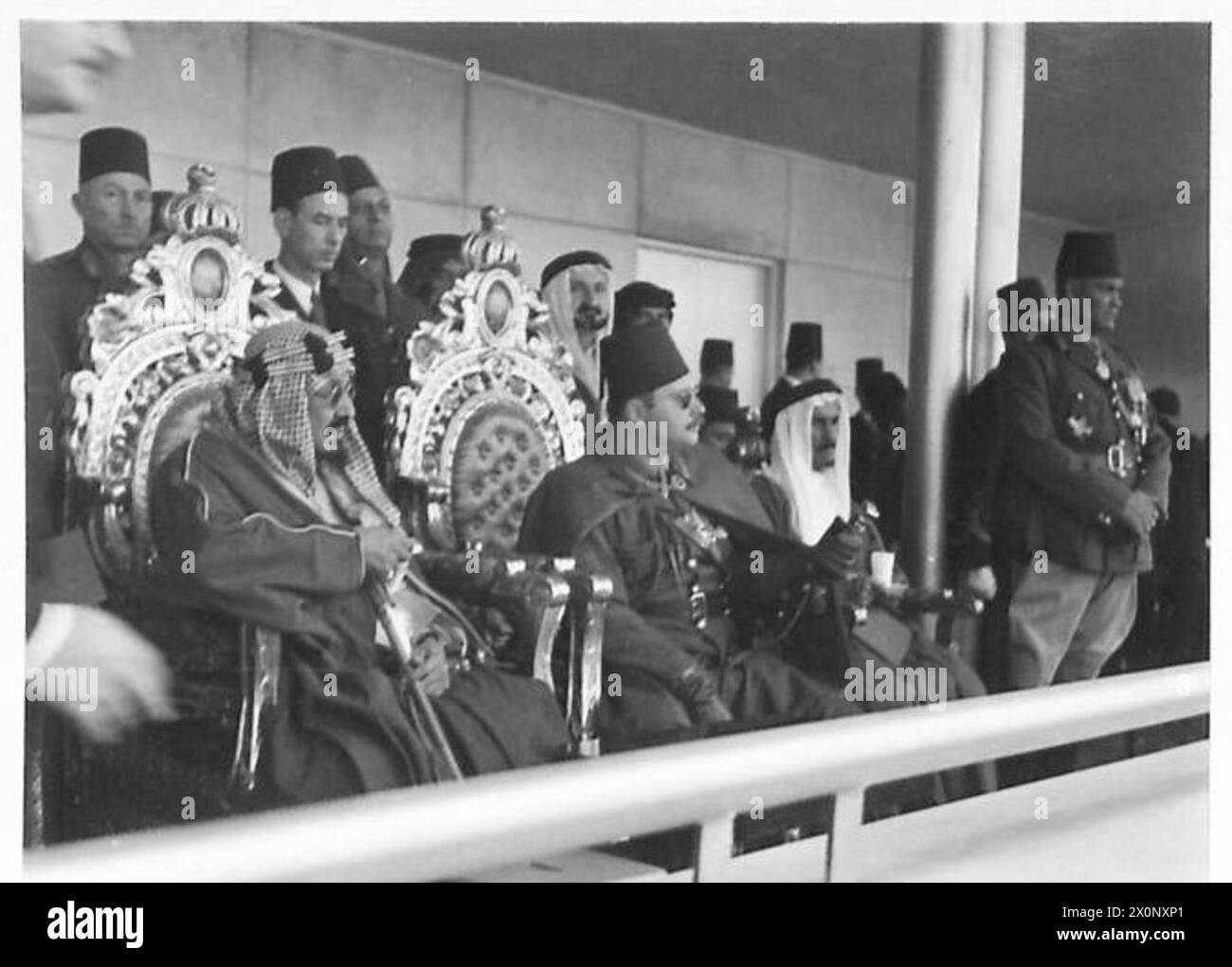KING IBN SAUD SEES EGYPT'S MILITARY MIGHT - King 'Abd al-'Aziz Ibn Saud of Saudia Arabia and King Farouk of Egypt, watch the parade from the royal dais Stock Photo