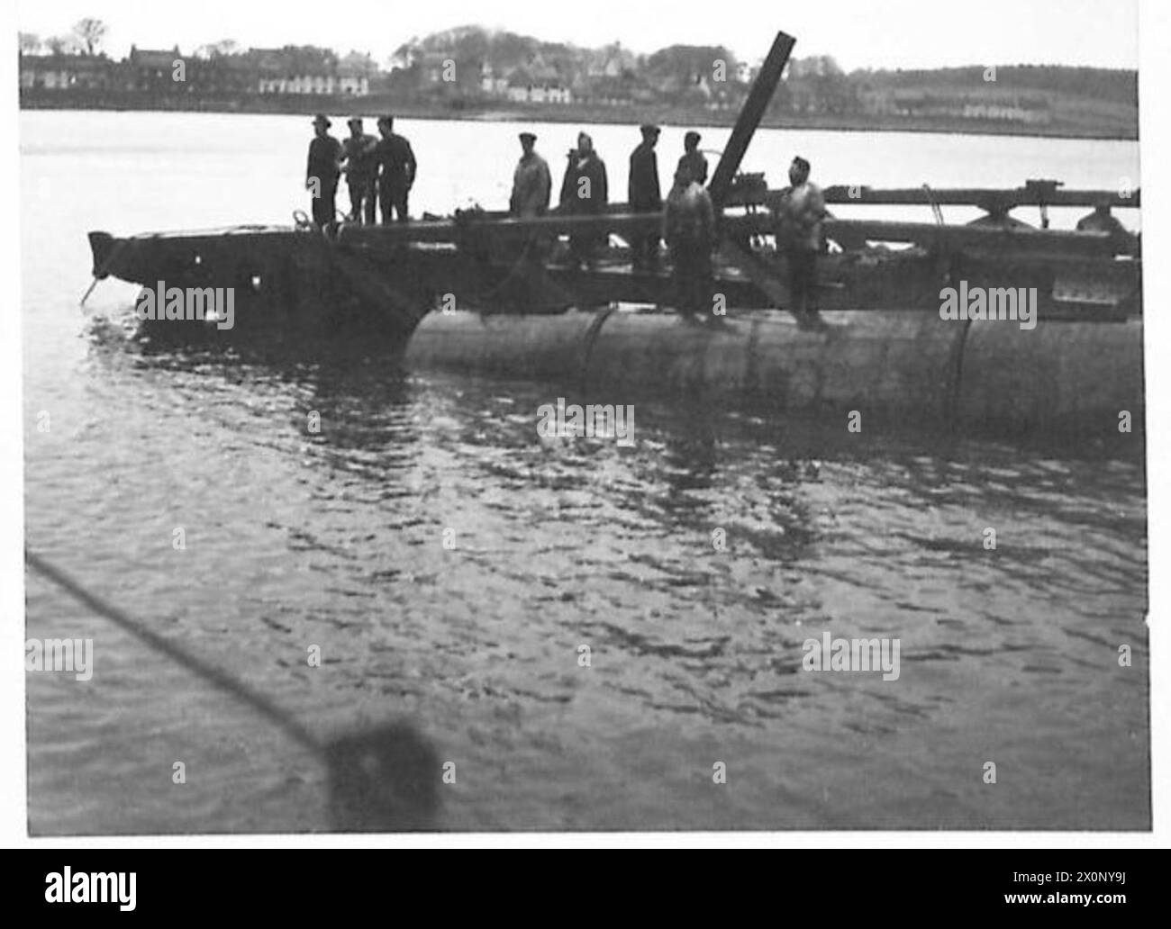 SPECIAL ASSIGNMENT D.T.N. - Photographs showing the operation of getting the first span away from the rocks. Operation was successful and the span was towed to Garlieston quayside. Photographic negative , British Army Stock Photo
