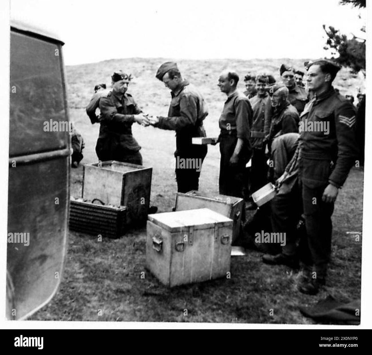 PIONEERS CLEARING LAND - Lining up for the mid-day meal. Photographic negative , British Army Stock Photo