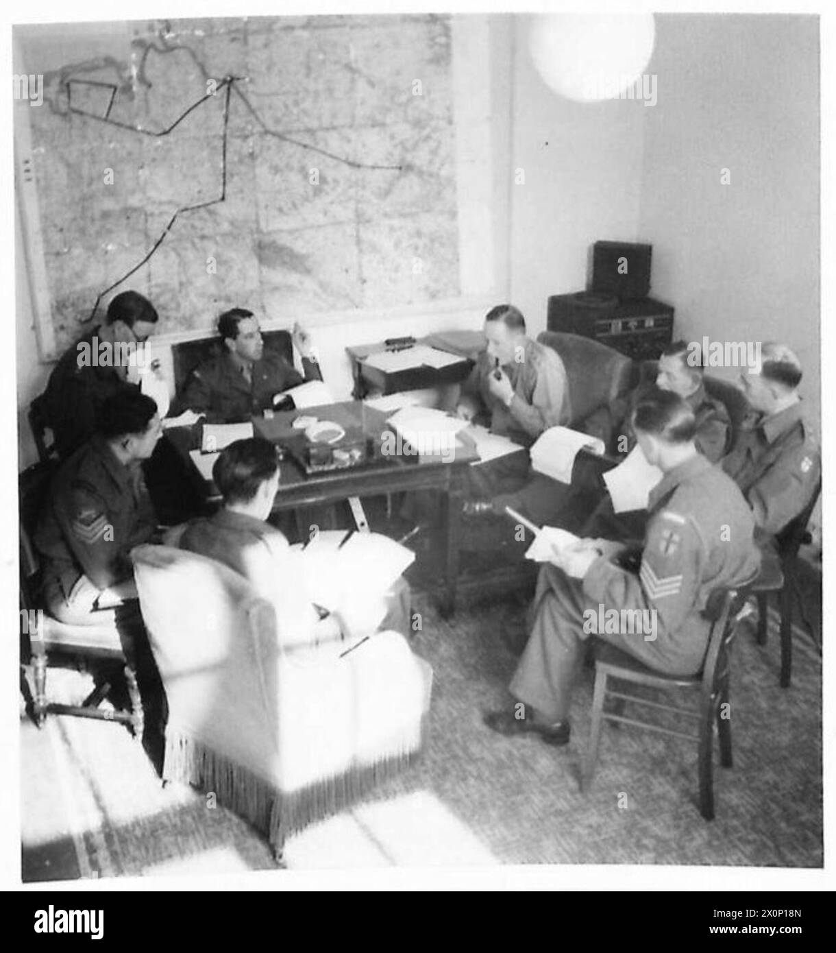 BRITISH FORCES BROADCASTING SERVICE IN HAMBURG 1945 - Every week BFN Hamburg held a Programme conference. Headed by Major John MacMillan, the Heads of the Programmes Department, Presentation Department, Variety and Music Department met to discuss a various subjects such as how many live broadcasts should BFN be transmitting BFN Hamburg Stock Photo