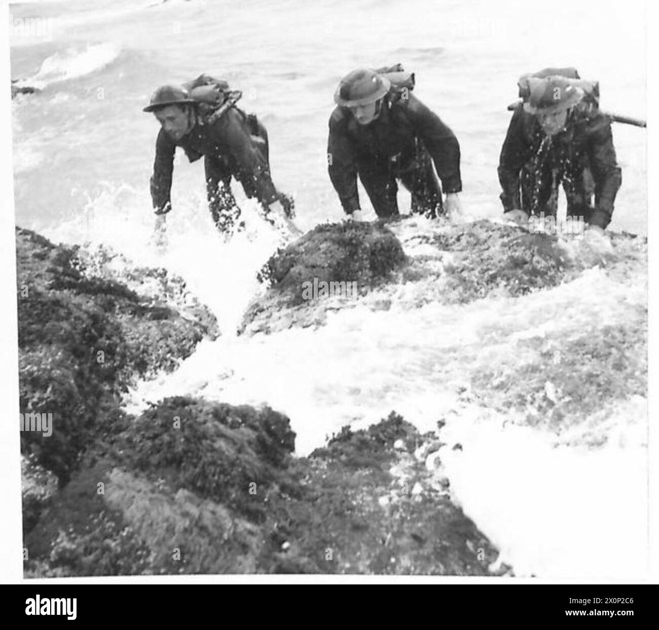 BRITAIN S SHOCK TROOPS - Troops clambering over the rocks after coming ...