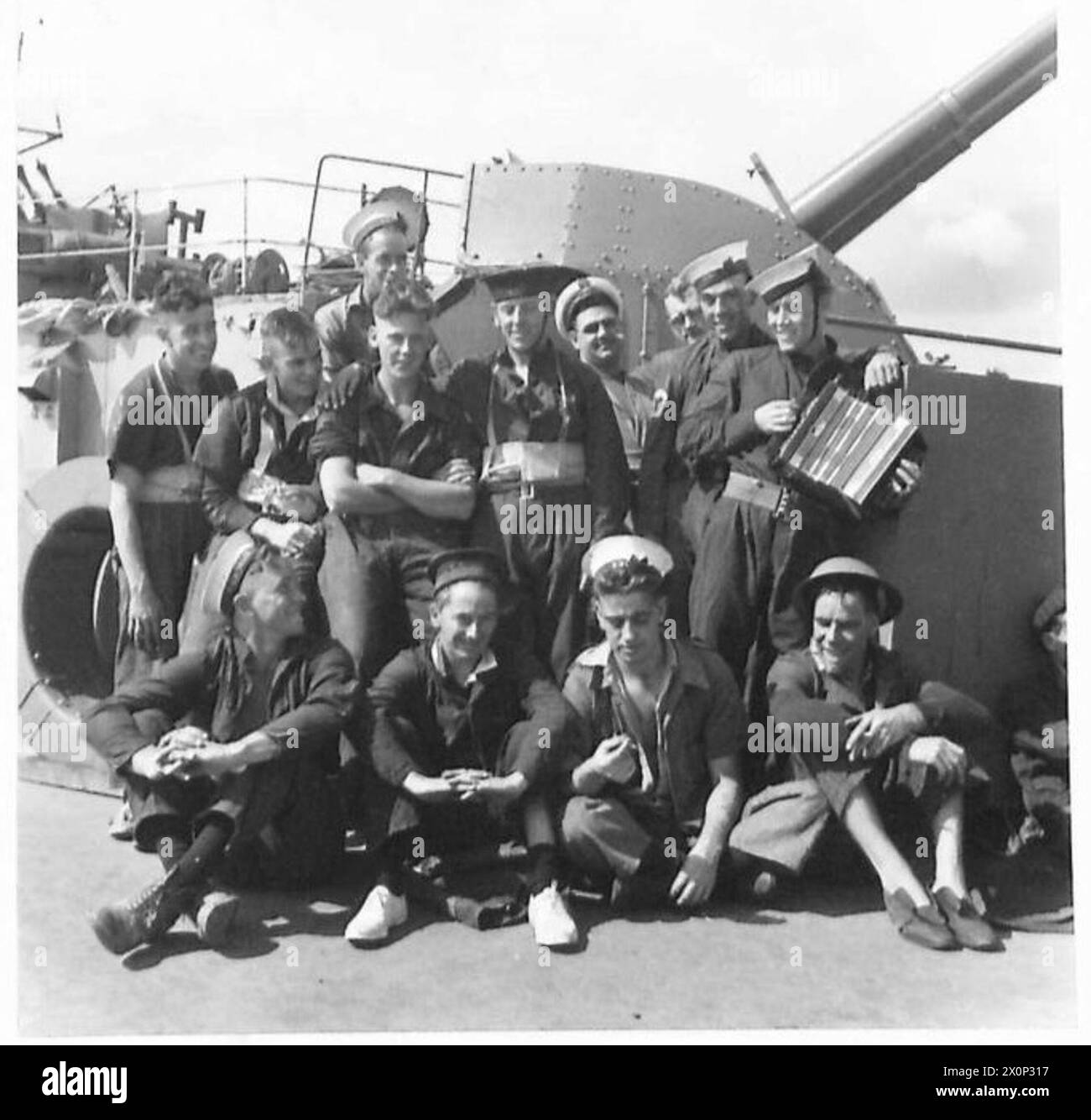 Crew members of a ship are photographed en route to Tobruk ...