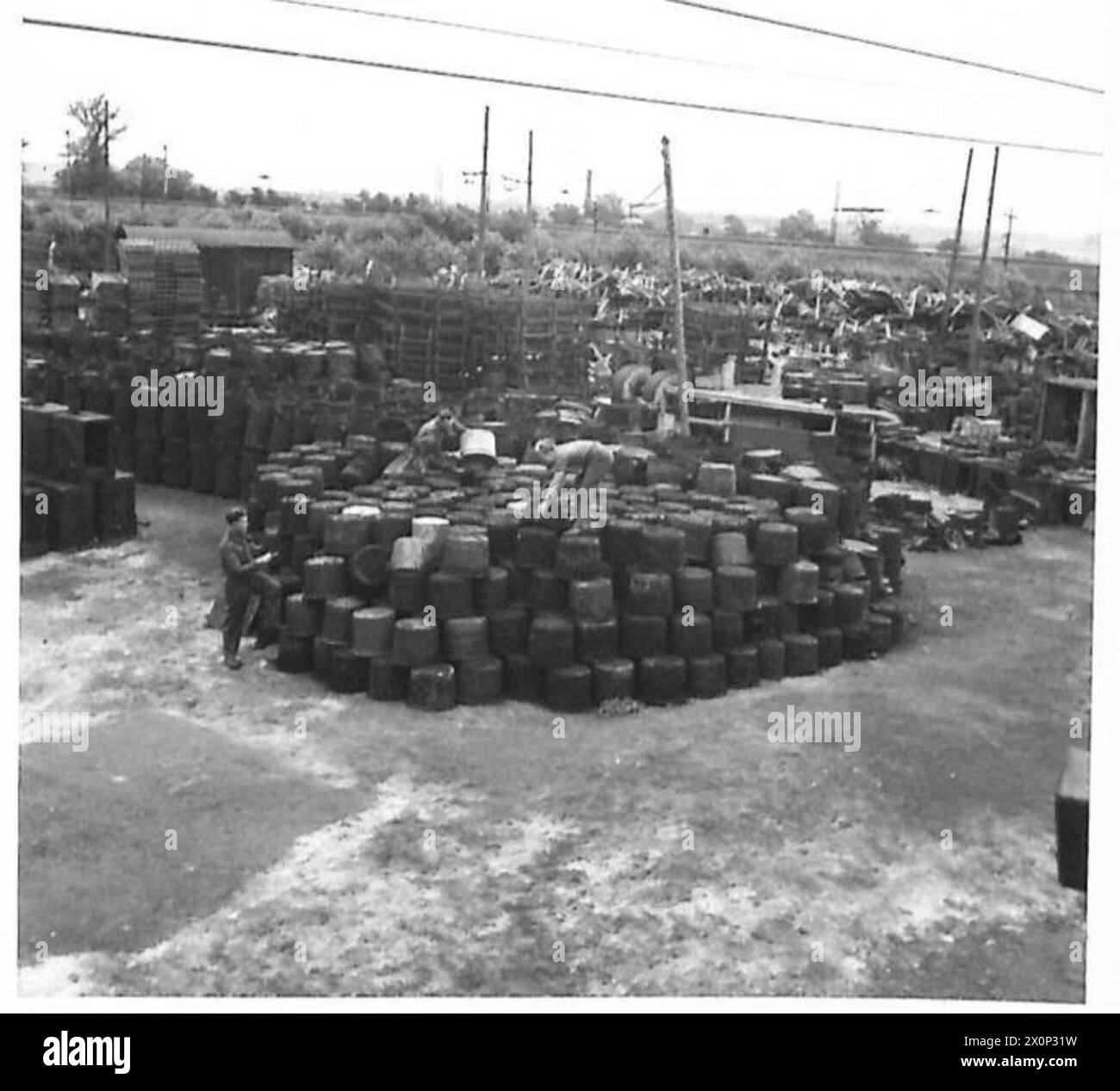 RAOC REPAIR WORKSHOP - Cooking stoves being sorted and stacked for repair. Photographic negative , British Army Stock Photo