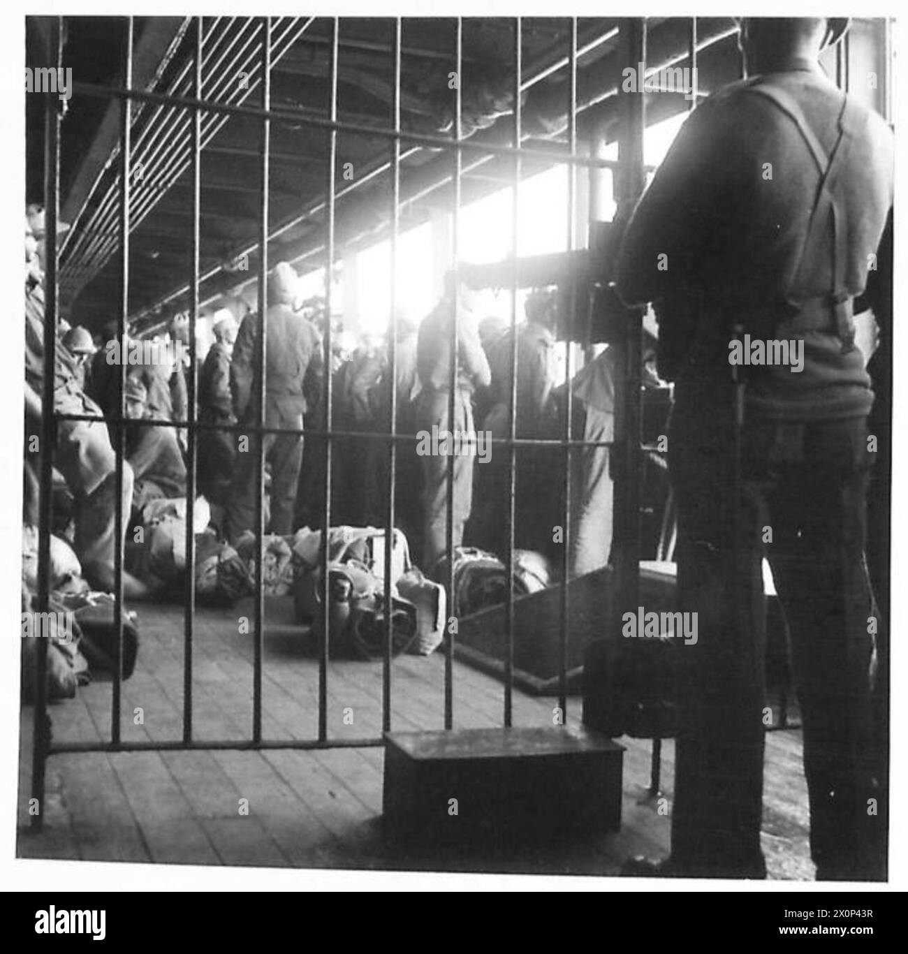 Prisoners under guard Black and White Stock Photos & Images - Alamy