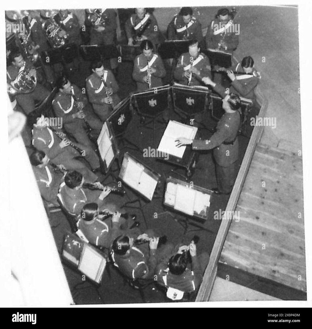 C.M.F. ARTS FESTIVAL : ROME 1946 - The Band of the Royal Dragoons, conducted by Mr. A.A. Singer, ARCM., giving a Festival performance at the NAAFI 'Alexander Club' on Tuesday afternoon 26th February Photographic negative , British Army Stock Photo