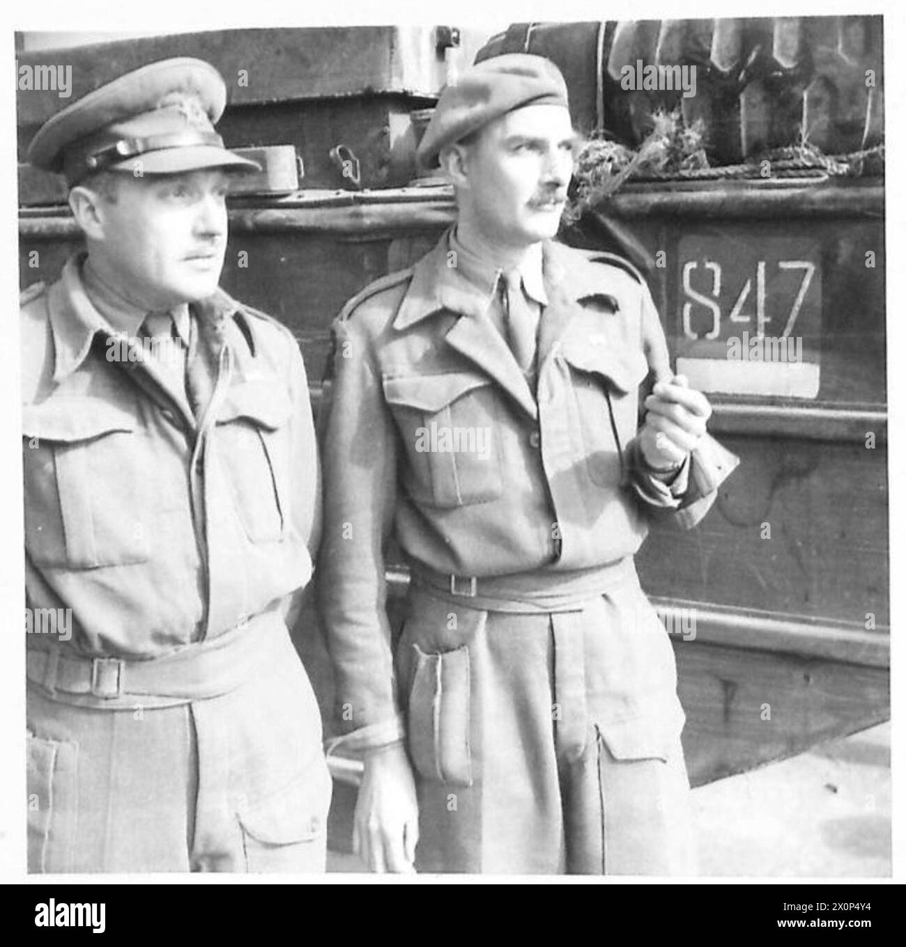 ITALY : FIFTH ARMYSUPPLIES FOR ANZIO BRIDGEHEAD - Capt. H. Baddeley of 99 Dodworth Road, Barnsley, Yorks and Major G. Schacht of St. Vincent, Woodland Grove, Weybridge. The latter is O.C. Ducks, or as the Army officially names them 'Dukws' - 259 General Transport Coy., R.A.S.C. Photographic negative , British Army Stock Photo