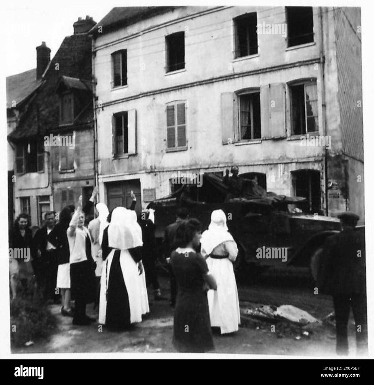 LIBERATION OF GISORS - Nuns left their convent to cheer our troops as they moved forward. Photographic negative , British Army, 21st Army Group Stock Photo