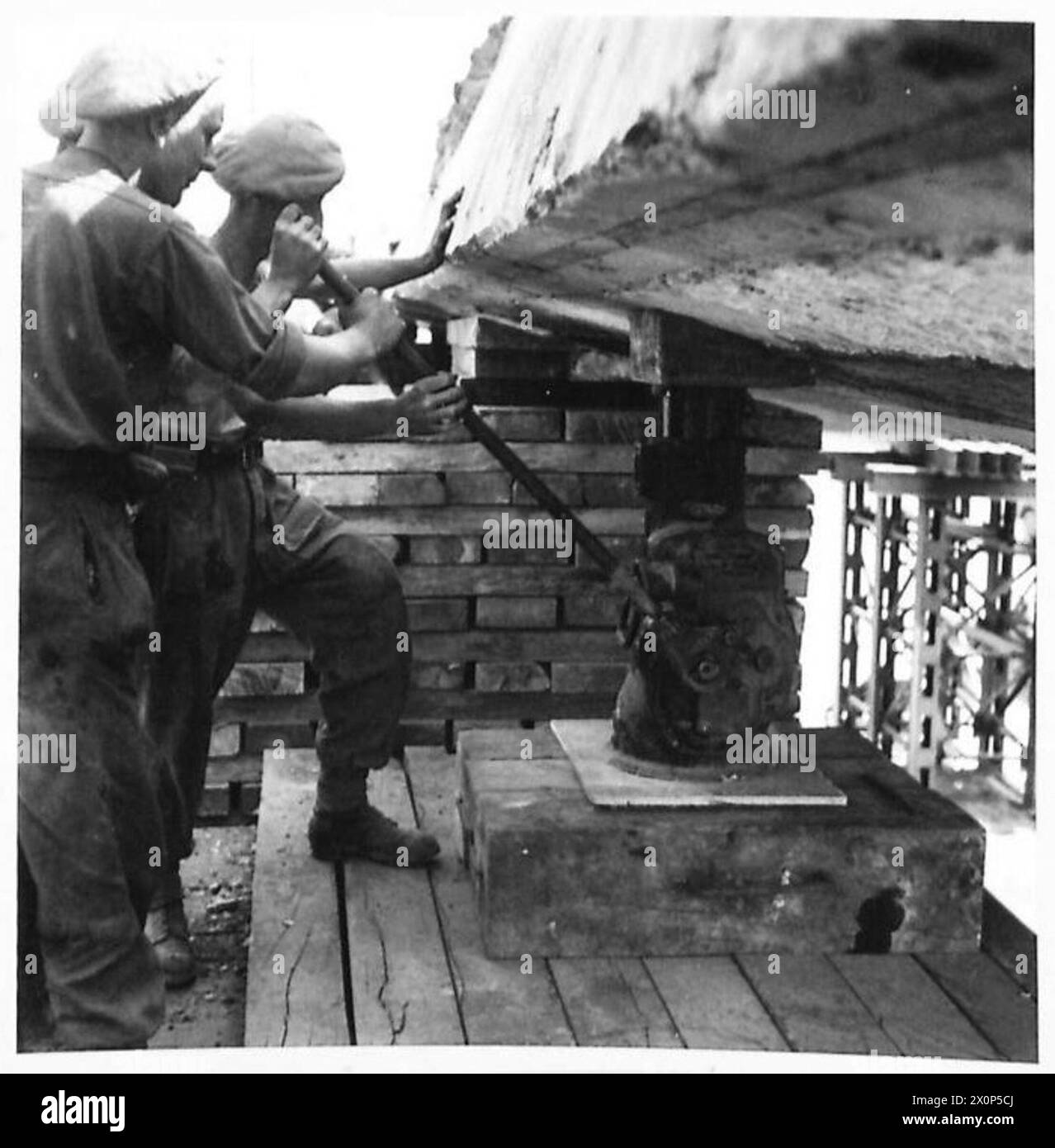 Engineers work on raising and reconstructing a bridge in Caen, France ...