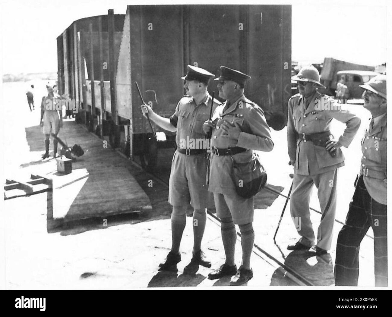 NEW EQUIPMENT ARRIVES IN EGYPT - Lieut. General Sir Henry Maitland Wilson, GOC..BTE., watching ships unloading the cargo of new equipment. Photographic negative , British Army Stock Photo