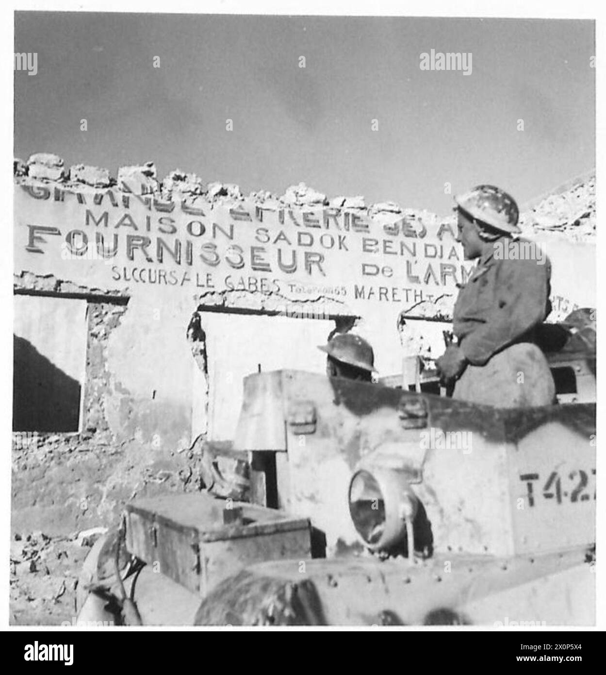 Shell damage to a shop in Mareth is recorded during the Eighth Army ...