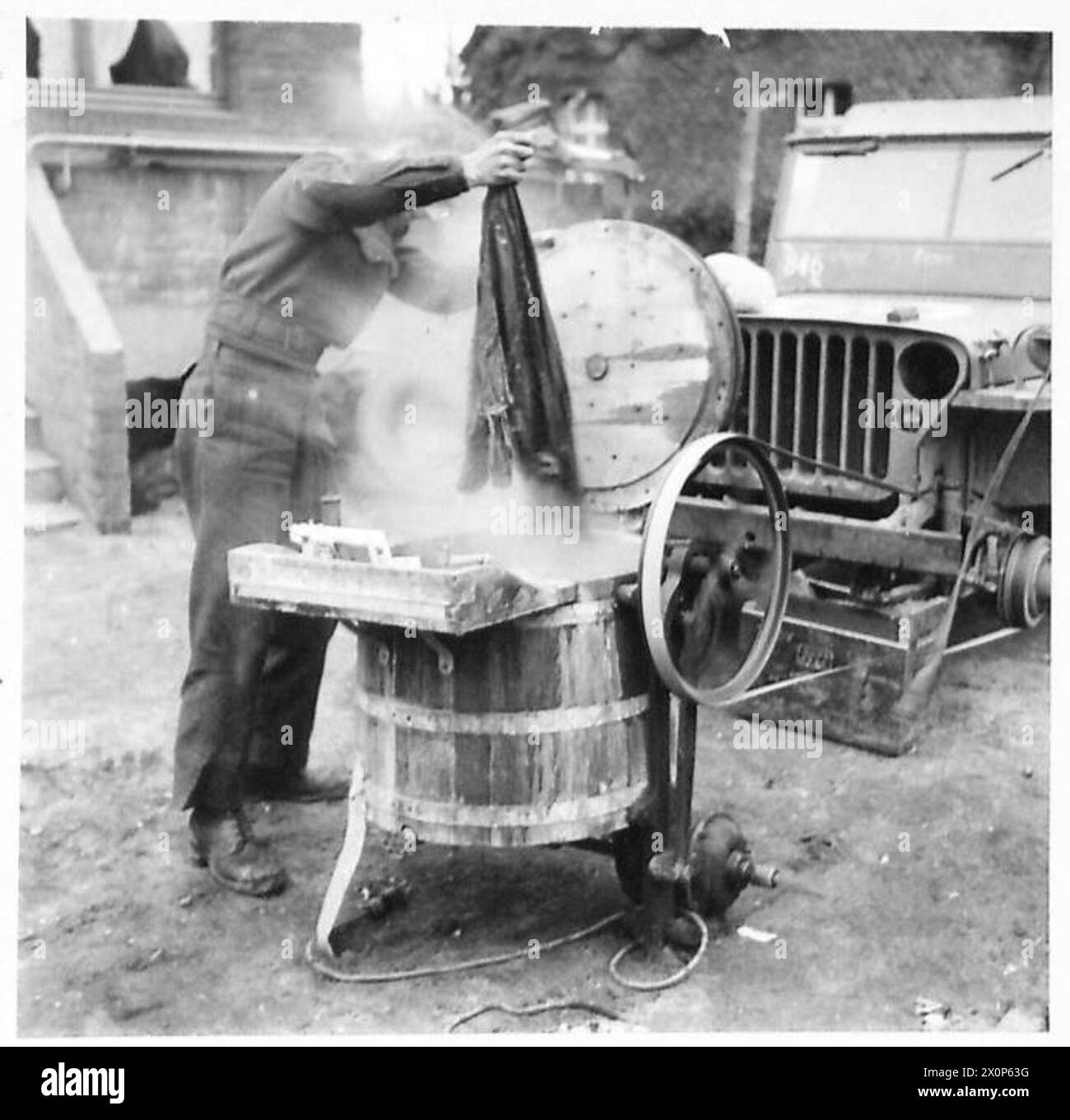 WASH DAY IN THE LINE ON GERMAN SOIL - The washing is finished in quick time and without effort and is not hung out to dry. Photographic negative , British Army, 21st Army Group Stock Photo